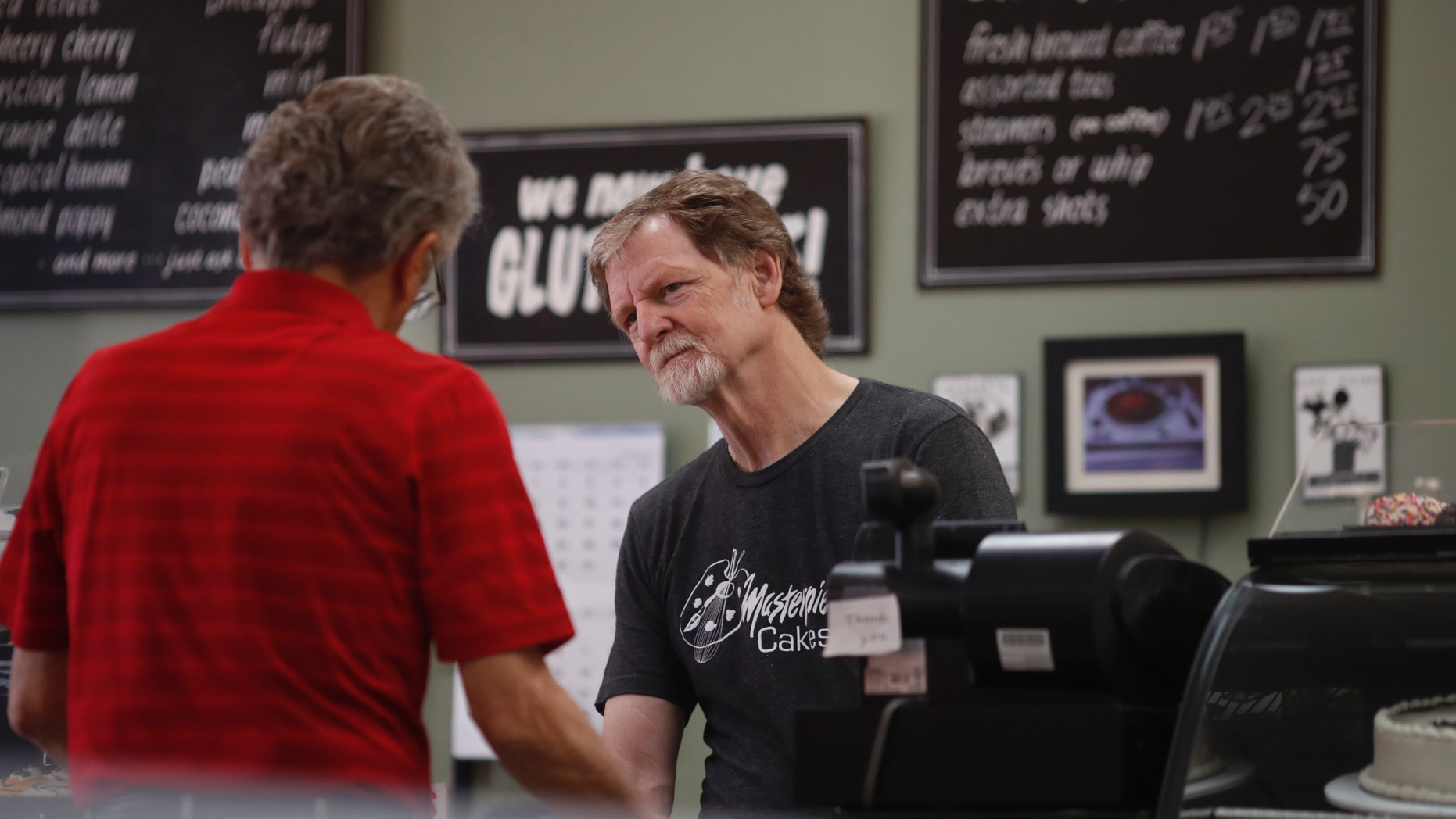 File - In this June 4, 2018, file photo, baker Jack Phillips, owner of Masterpiece Cakeshop, manages his shop in Lakewood, Colo. The state of Colorado and Phillips who refuses to make wedding cakes for gay and transgender customers on religious grounds have agreed to end their legal fight. A statement from the Colorado Attorney General's office on Tuesday, March 5, 2019, announced that the state and cakeshop owner Jack Phillips mutually agreed to end litigation in state and federal courts. (AP Photo/David Zalubowski, File)