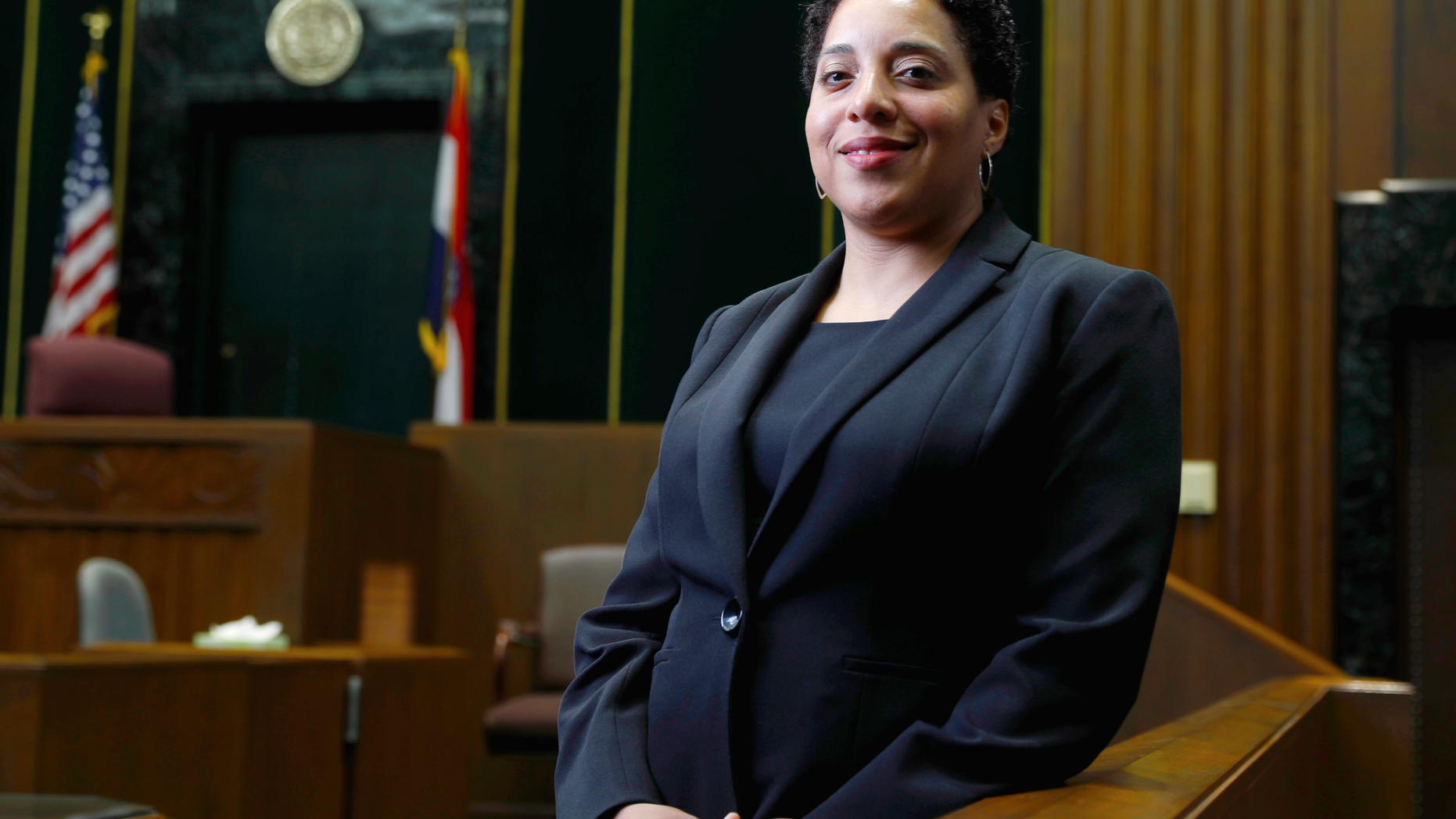 FILE - In this May 5, 2017, file photo, St. Louis Circuit Attorney Kim Gardner poses for a photo in St. Louis. An attorney for St. Louis Circuit Attorney Kim Gardner is accusing police, a special prosecutor and a judge of trying to "intimidate and humiliate" her through a search warrant of electronic records in her office. The search warrant is part of an investigation into whether a man Gardner hired last year to investigate former Gov. Eric Greitens lied under oath during a deposition. (AP Photo/Jeff Roberson, File)