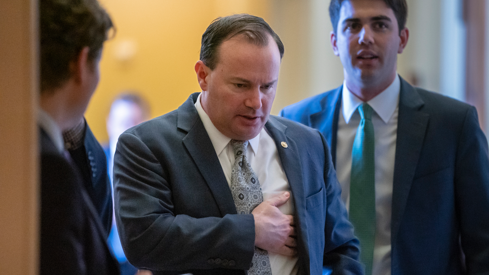 Sen. Mike Lee, R-Utah, leaves a Republican lunch meeting and heads to the chamber where he voted to reject President Donald Trump's declaration of a national emergency at the southwest border, at the Capitol in Washington, Thursday, March 14, 2019. Twelve Republicans joined Democrats in defying Trump. (AP Photo/J. Scott Applewhite)