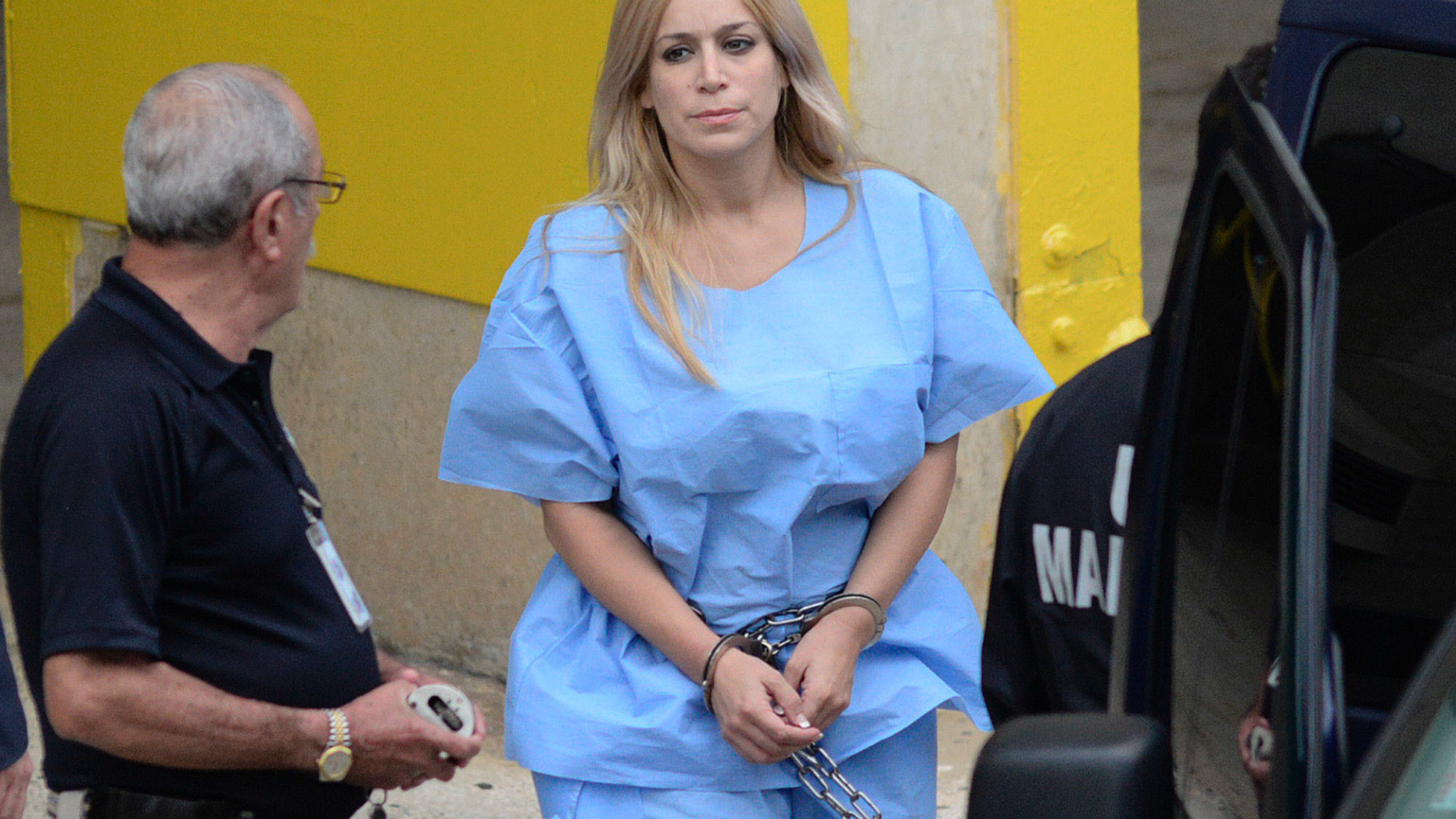 FILE - This Sept. 24, 2015 file photo shows Aurea Vazquez Rijos, who was accused more than a decade ago of the murder of her wealthy husband, Canadian Adam Anhang, in San Juan, Puerto Rico. Vazquez was found guilty of hiring a hit man to kill her husband more than a decade ago has been sentenced to life in prison. Vazquez cried as a federal judge issued the sentence Friday, March 15, 2019, and ordered that she be transferred to a prison in Fort Worth, Texas. (Carlos Giusti/El Vocero via AP File)