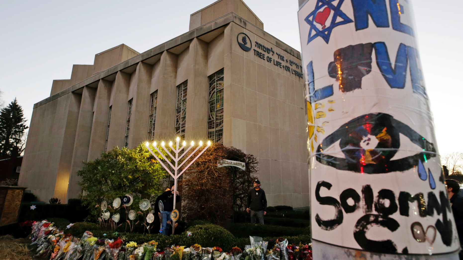 A menorah is tested outside the Tree of Life Synagogue in preparation for a celebration service at sundown on the first night of Hanukkah, in the Squirrel Hill neighborhood of Pittsburgh, on Dec. 2, 2018. (AP Photo/Gene J. Puskar, File)