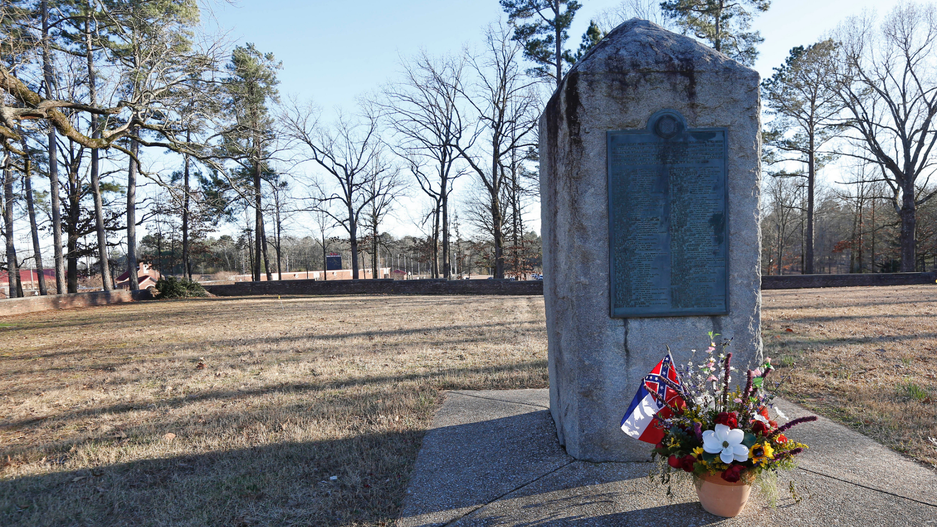 File-This March 5, 2019, file photo shows a memorial marker standing in the University of Mississippi campus cemetery that has the graves of Confederate soldiers killed at the Battle of Shiloh.  The University of Mississippi's leader says he agrees that a Confederate monument should be shifted from its current spot on campus. Interim Chancellor Larry Sparks said in a Thursday, March 21, 2019, statement that he is consulting with historic preservation officials on relocating the statue. (AP Photo/Rogelio V. Solis, File)