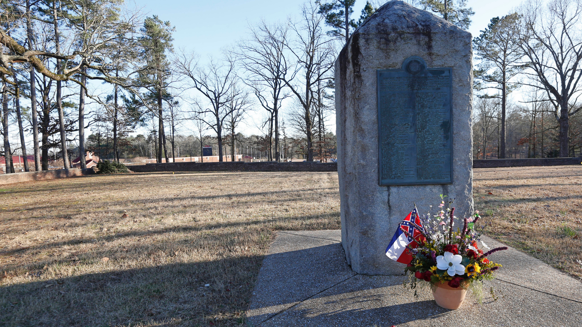 File-This March 5, 2019, file photo shows a memorial marker standing in the University of Mississippi campus cemetery that has the graves of Confederate soldiers killed at the Battle of Shiloh. The University of Mississippi's leader says he agrees that a Confederate monument should be shifted from its current spot on campus. Interim Chancellor Larry Sparks said in a Thursday, March 21, 2019, statement that he is consulting with historic preservation officials on relocating the statue. (AP Photo/Rogelio V. Solis, File)