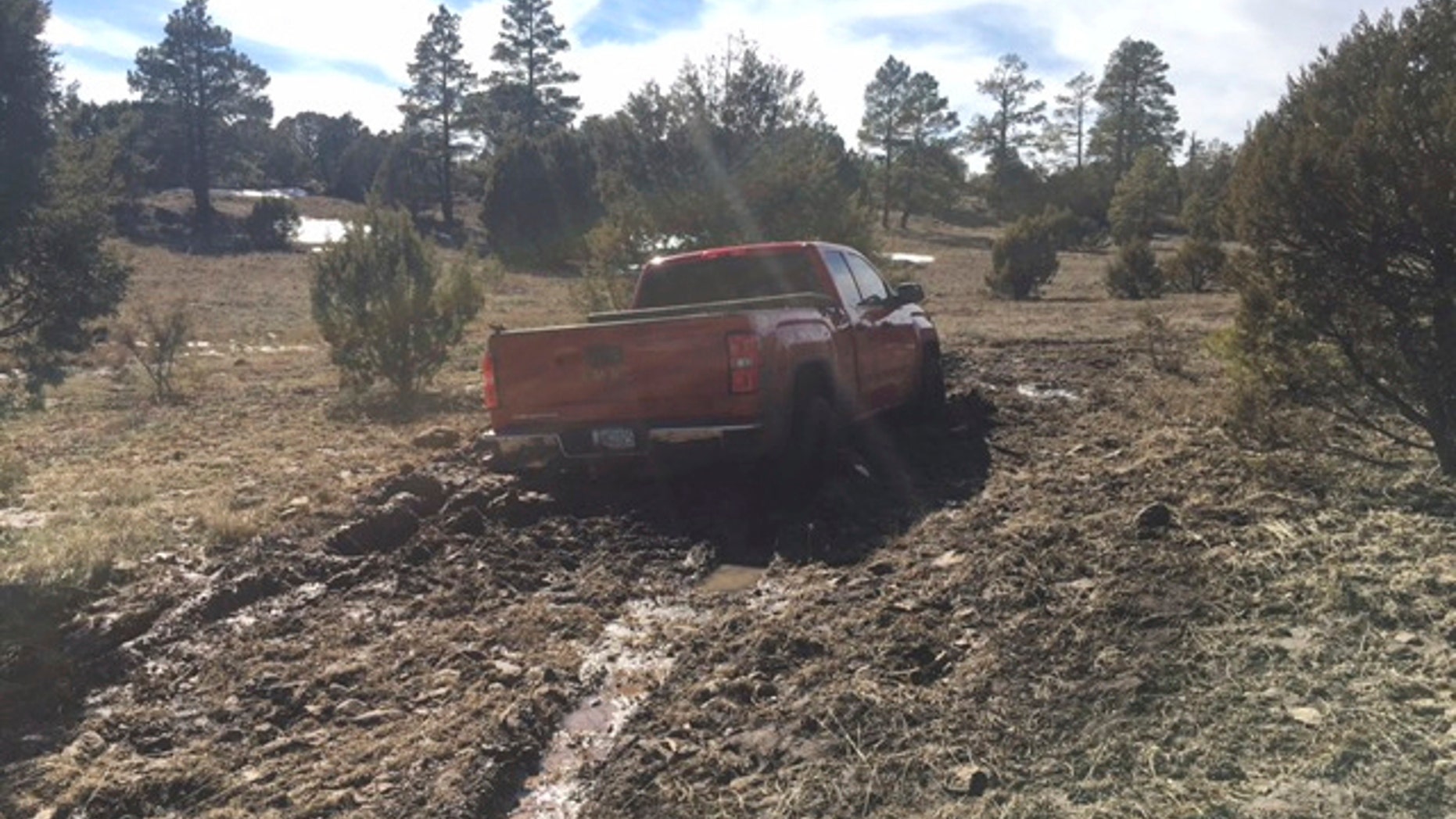 This March 2019 photo provided by the Coconino County Sheriff's Office shows a vehicle belonging to Ryan Long near Happy Jack, Ariz. Long, 38, who likely died from exposure while stranded in Arizona might have survived if he had not rejected rescue efforts because he was afraid of being arrested, authorities said Tuesday, March 19, 2019. (Coconino County Sheriff's Office via AP)