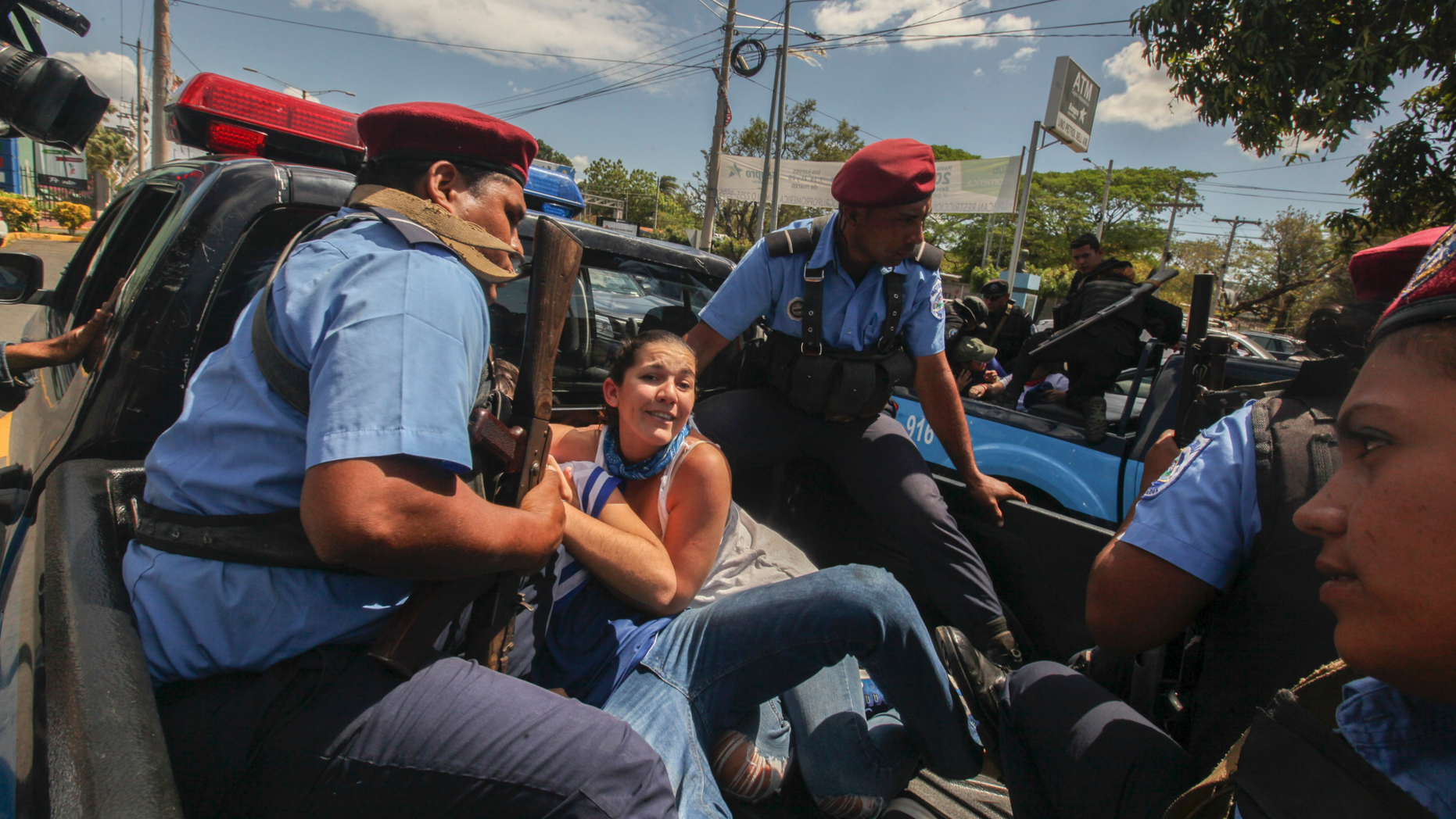 Police detain protesters in Managua, Nicaragua, on Saturday. (AP Photo/Alfredo Zuniga)