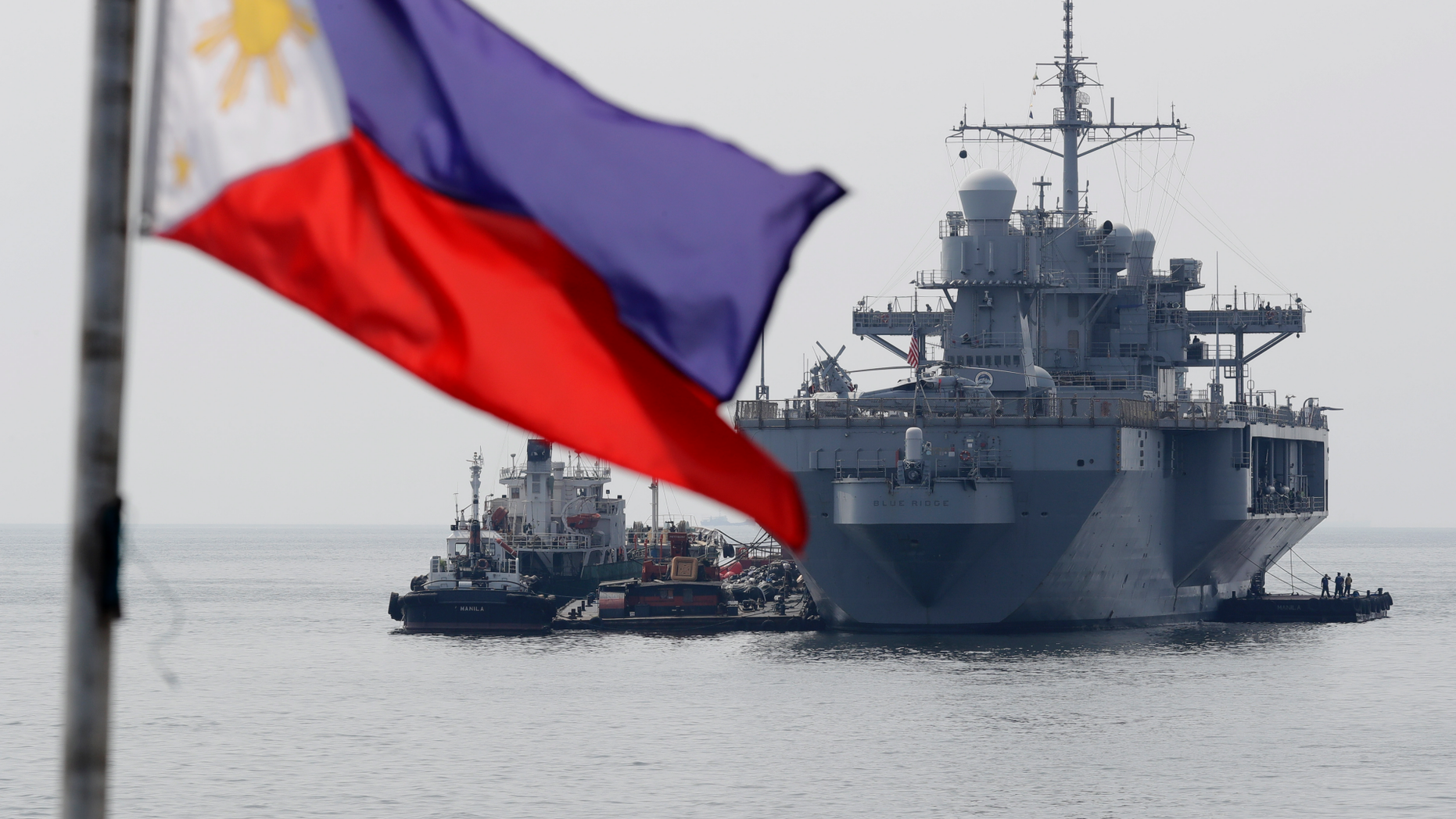 The USS Blue Ridge (LCC-19), the U.S. 7th Fleet Flagship, is anchored off Manila Bay west of Manila, Philippines for a routine port call Wednesday, March 13, 2019. Capt. Eric Anduze, Commander of the USS Blue Ridge, renewed an American vow to "sail, fly and operate wherever the law allows us to" amid China's objection to U.S. military presence in the disputed South China Sea. (AP Photo/Bullit Marquez)