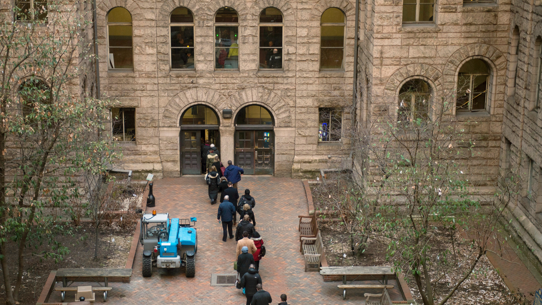 People arrive at the Allegheny County Courthouse before the start of the second day of the trial for homicide of former East Pittsburgh police officer, Michael Rosfeld, on Wednesday, March 20, 2019 in Pittsburgh. Rosfeld, 30, faces a charge of criminal homicide for the death in June 2018 of Antwon Rose II, a 17-year-old unarmed high school student. (Nate Smallwood / Pittsburgh Tribune-Review via AP, Pool)