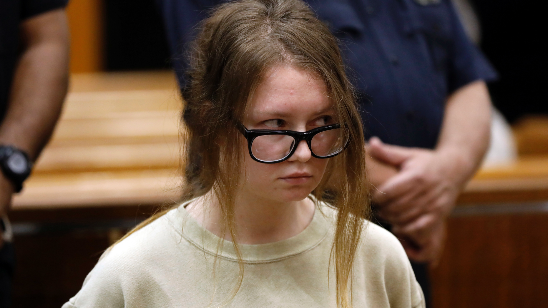 FILE - In this Oct. 30, 2018 file photo, Anna Sorokin appears in New York State Supreme Court on grand larceny charges. On Wednesday, March 27, 2019, Sorokin, the one-time darling of the Big Apple social scene is scheduled to stand trial on grand larceny and theft of services charges alleging she swindled $275,000 in a 10-month odyssey that saw her jetting to Omaha and Marrakesh. (AP Photo/Richard Drew, File)