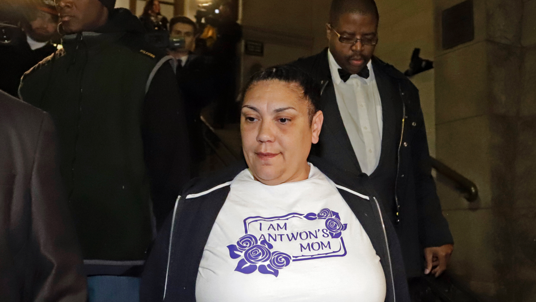 Michelle Kenney, center, the mother of Antwon Rose II, leaves the Allegheny County Courthouse with supporters after hearing the verdict of not guilty on all charges for Michael Rosfeld, a former police officer in East Pittsburgh, Pa., Friday, March 22, 2019. Rosfeld was charged with homicide in the fatal shooting of Antwon Rose II as he fled during a traffic stop on June 19, 2018. (AP Photo/Gene J. Puskar)