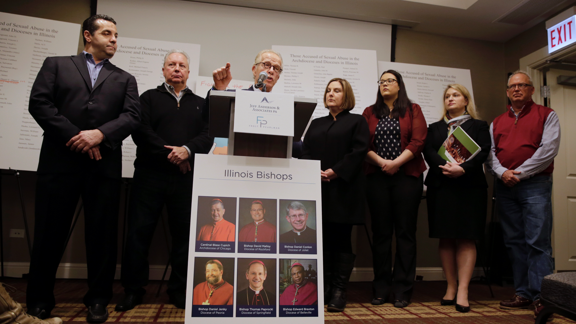 Attorney Jeff Anderson speaks as attorney Marc Pearlman, left, and clergy abuse victims listen during a news conference, Wednesday, March 20, 2019, in Chicago. Advocates for clergy abuse victims say their list of 395 priests or lay people in Illinois who have been publicly accused of sexually abusing children is far more extensive than the names already released by the state's six dioceses. (AP Photo/Kiichiro Sato)