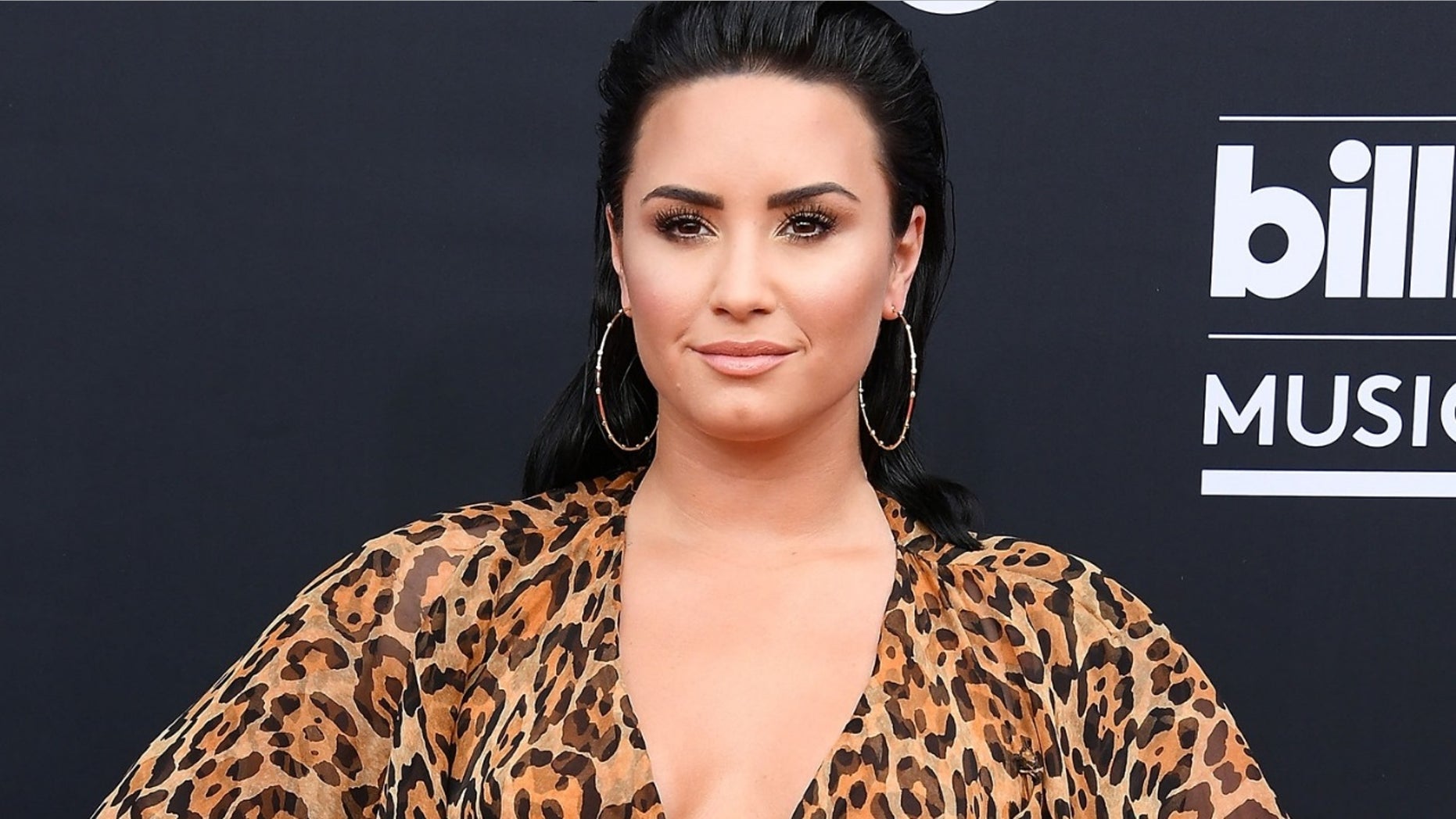 Singer Demi Lovato appeared shocked to learn that she had knocked out her trainer’s front tooth while working out.