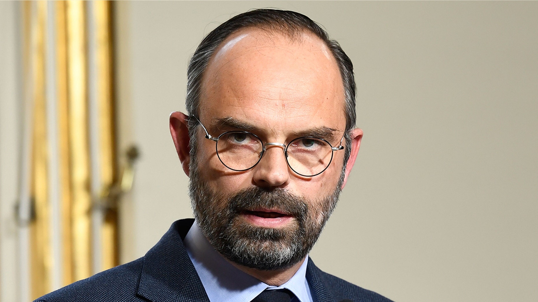 French Prime Minister Edouard Philippe (L) gives a press conference, on March 18, 2019 at the Matignon hotel in Paris, to announce measures after weekend riots. (Photo by Bertrand GUAY / AFP) (Photo credit should read BERTRAND GUAY/AFP/Getty Images)
