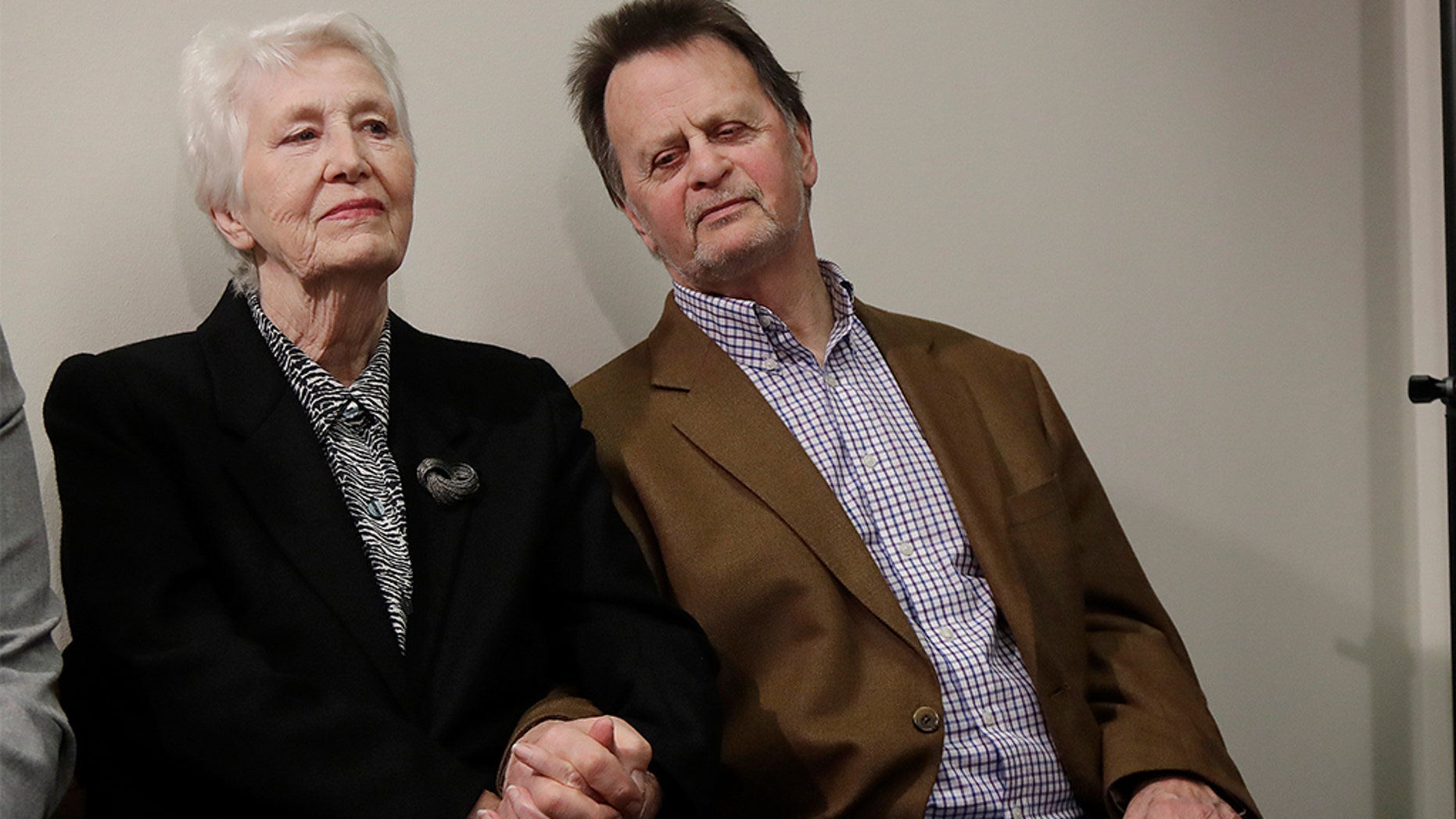 Edwin Hardeman, right, sits with his wife, Mary, at a press conference in San Francisco on Wednesday. (AP Photo / Jeff Chiu)