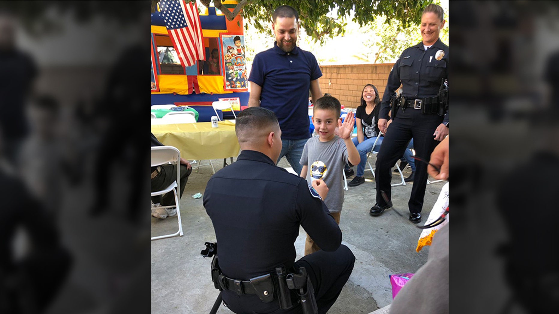 The Santa Ana Police Department sent over a few of its officers to Ewinn’s party Saturday afternoon — “to swear him in as a Jr. officer.” (Santa Ana Police Department)