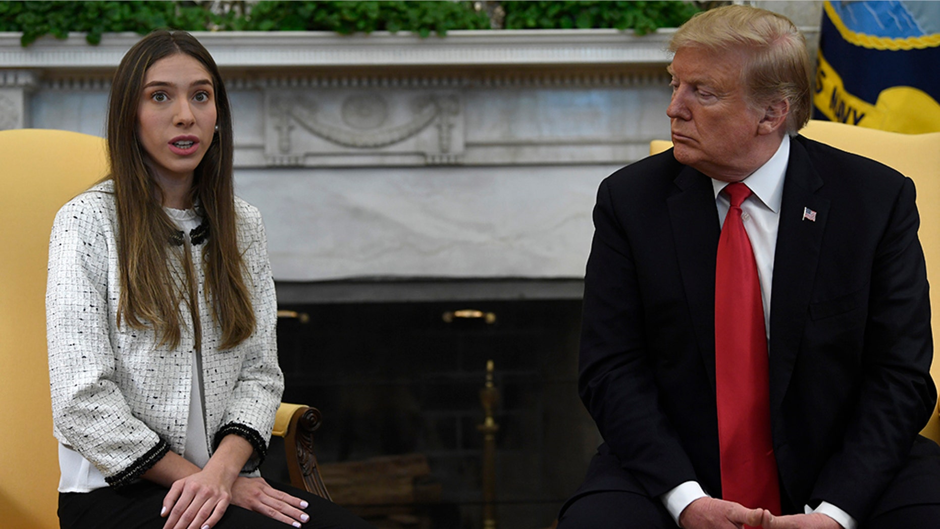 President Donald Trump, right, listens during a meeting with Fabiana Rosales, left, a Venezuelan activist who is the wife of Venezuelan opposition leader Juan Guaido, as she speaks in the Oval Office of the White House in Washington, Wednesday, March 27, 2019. (AP Photo/Susan Walsh)