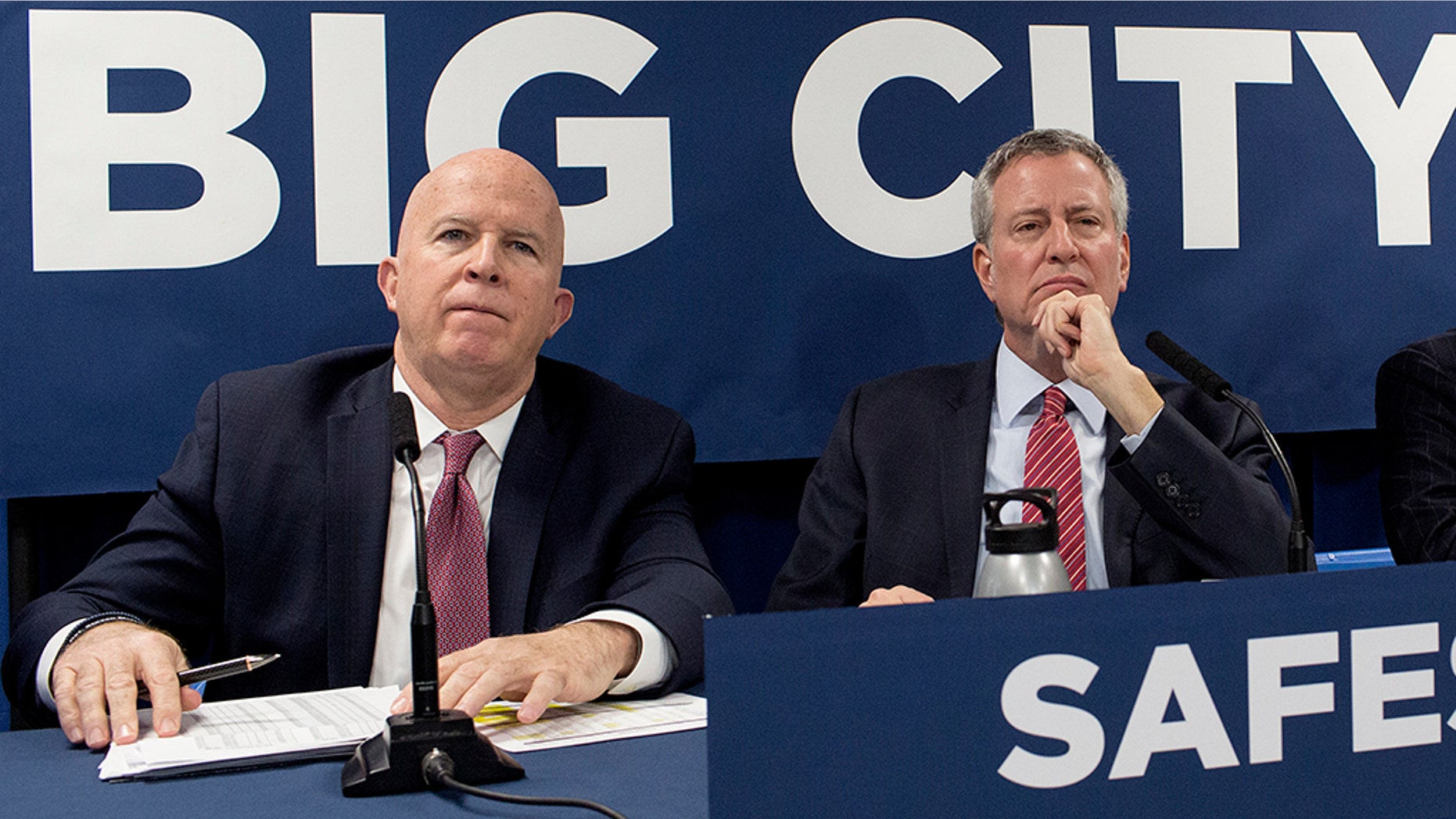 New York City Police Commissioner James O’Neill (left) said on Monday that the department has a new five-point plan to combat rising violent crime