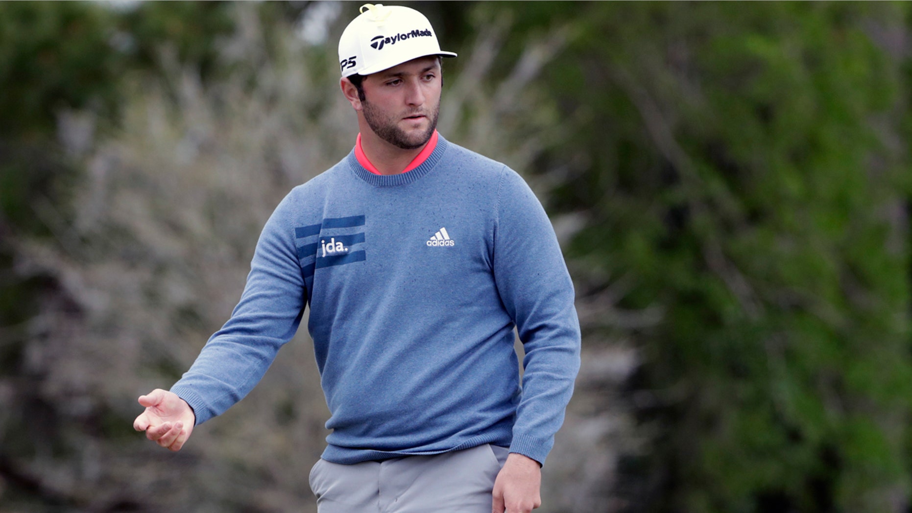Jon Rahm, of Spain, reacts to his putt on the second hole during the final round of The Players Championship golf tournament Sunday, March 17, 2019, in Ponte Vedra Beach, Fla. (AP Photo/Lynne Sladky)