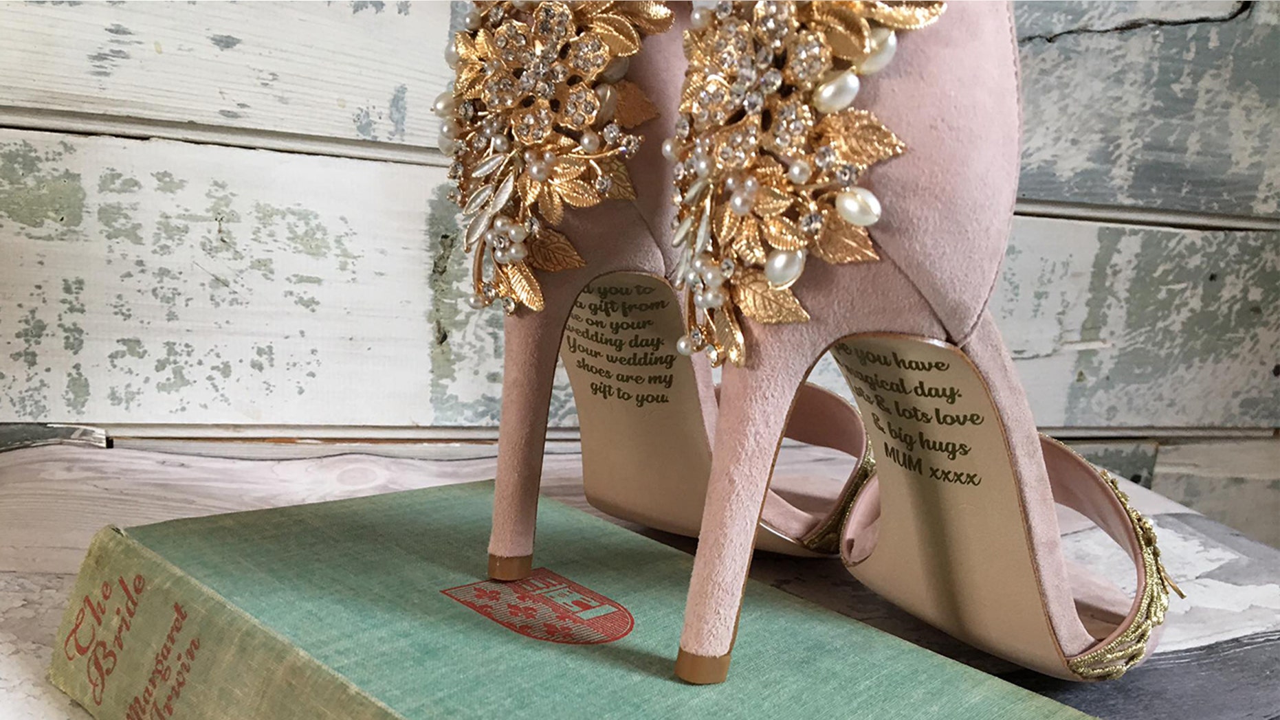 Emma was thrilled when she got her pink antelope wedding dresses on the desk - her mother's shoes were paid and she wrote them with a secret message.