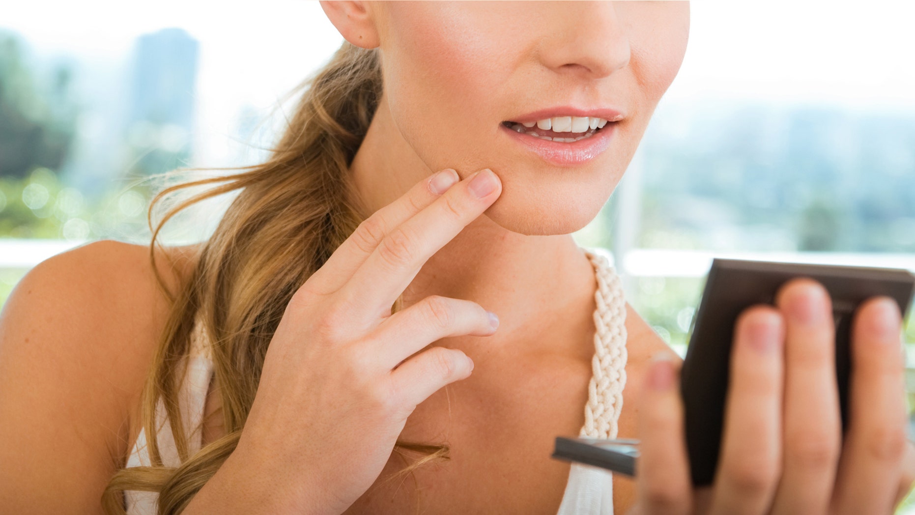 The young woman claims her ex criticized her initial choice to hide her acne with makeup. "He said that I shouldn't lead people on like that,” she said.<br>