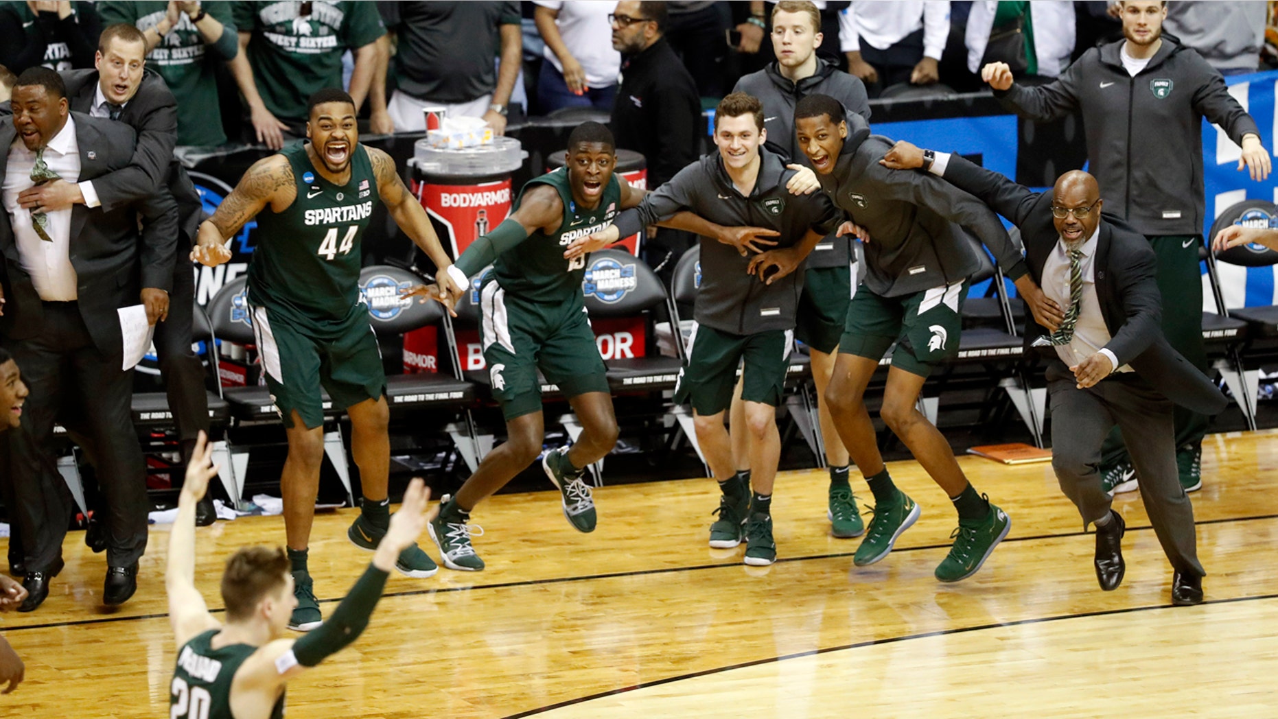 Michigan State players begin to celebrate their win over Duke at the end of the NCAA men's East Regional final college basketball game in Washington, Sunday, March 31, 2019. (AP Photo}
