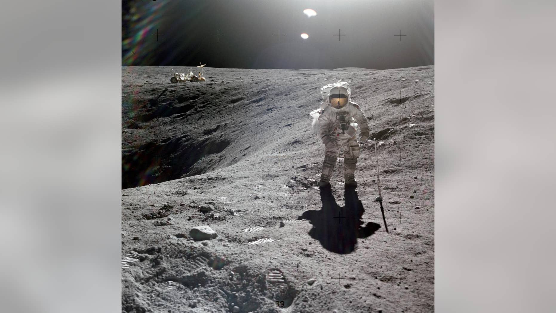 Charles Duke, Apollo 16's lunar module pilot, is photographed collecting lunar samples at Station No. 1, during the first Apollo 16 extravehicular activity (EVA), at the Descartes landing site. (NASA)
