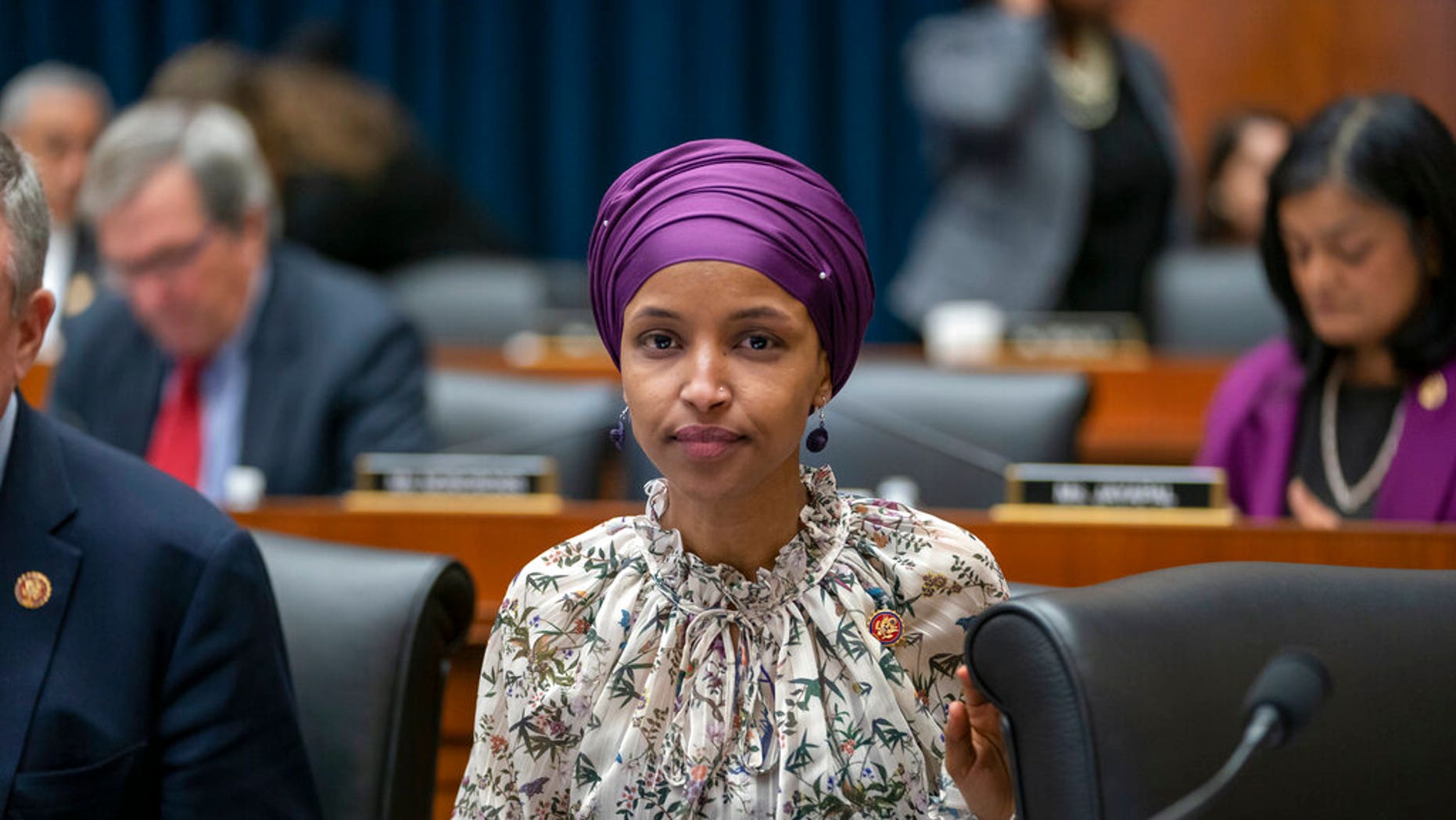 Rep. Ilhan Omar, D-Minn., sits with fellow Democrats on the House Education and Labor Committee during a bill markup, on Capitol Hill in Washington, Wednesday, March 6, 2019. (AP Photo/J. Scott Applewhite)