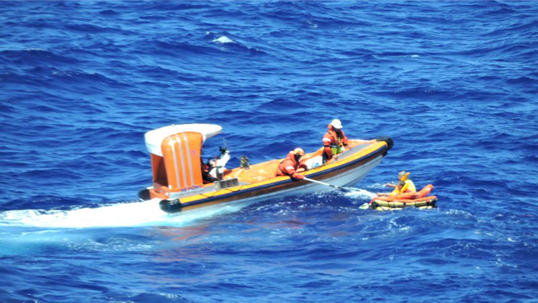 The cruise sent out a dinghy to retrieve the men as passengers aboard the Regal Princess watched and cheered from the ship’s deck.