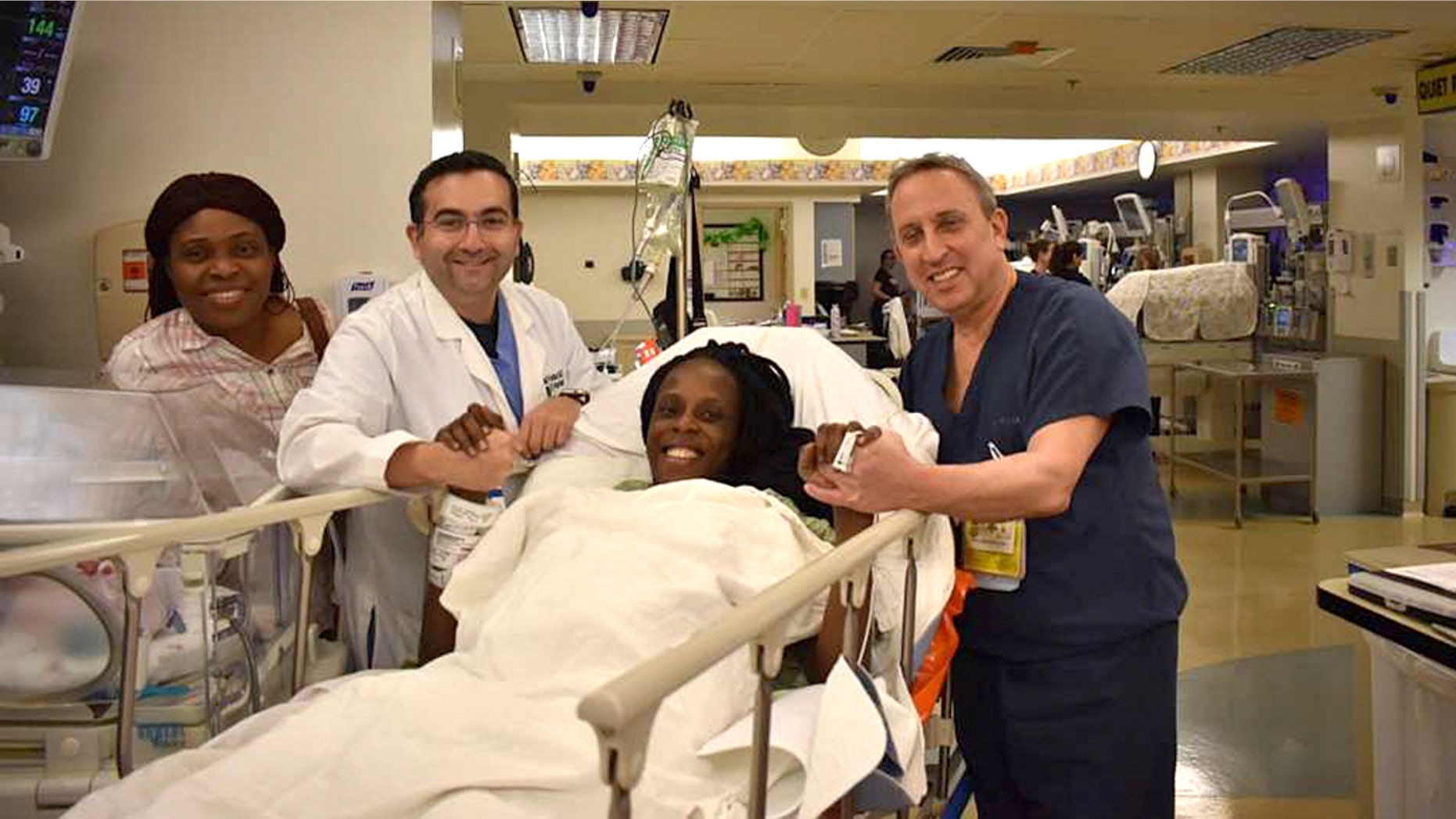 Thelma Chiaka with (l. to r.) relative Ebere Ofor; Dr. Ziad Haidar, perinatologist who delivered the babies; and Dr. Israel Simchowit, neonatologist also on staff at The Woman’s Hospital of Texas.