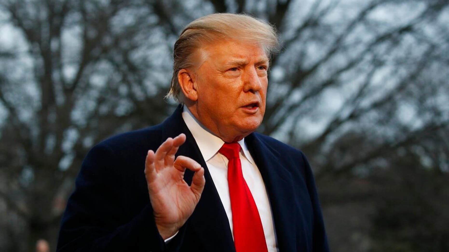 President Donald Trump speaks with the media after stepping off Marine One on the South Lawn of the White House, Sunday, March 24, 2019, in Washington. The Justice Department said Sunday that special counsel Robert Mueller's investigation did not find evidence that President Donald Trump's campaign "conspired or coordinated" with Russia to influence the 2016 presidential election. (AP Photo/Alex Brandon)