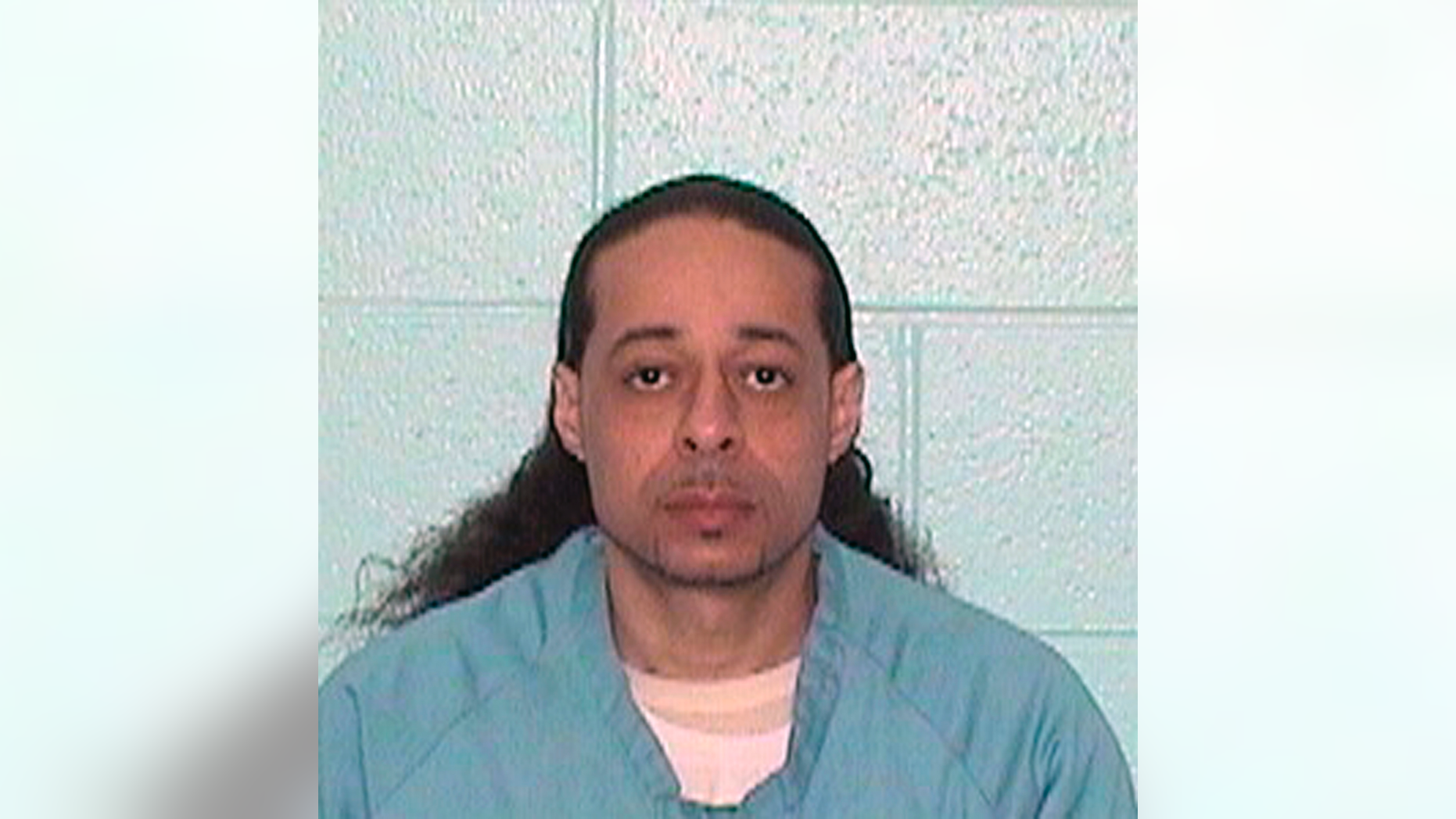 This undated booking photo released by Illinois Department of Corrections shows Floyd E. Brown. Illinois State Police say Brown, 39, suspected of shooting a sheriff's deputy and a woman Thursday, March 7, 2019 at an Illinois hotel crashed his vehicle along an interstate highway while trying to flee police. (Illinois Department of Corrections via AP)