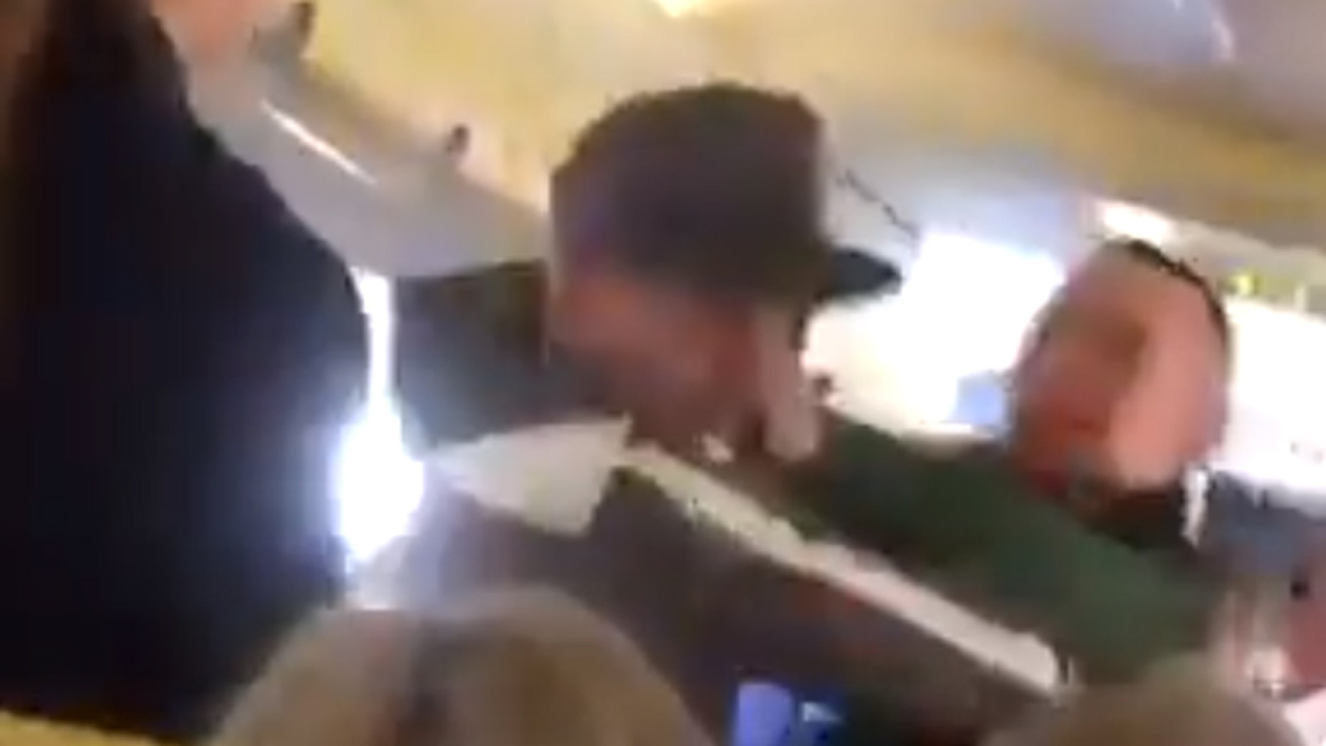 We saw two Ryanair passengers fighting in a shocking video before one of them was escorted with a bloody face.