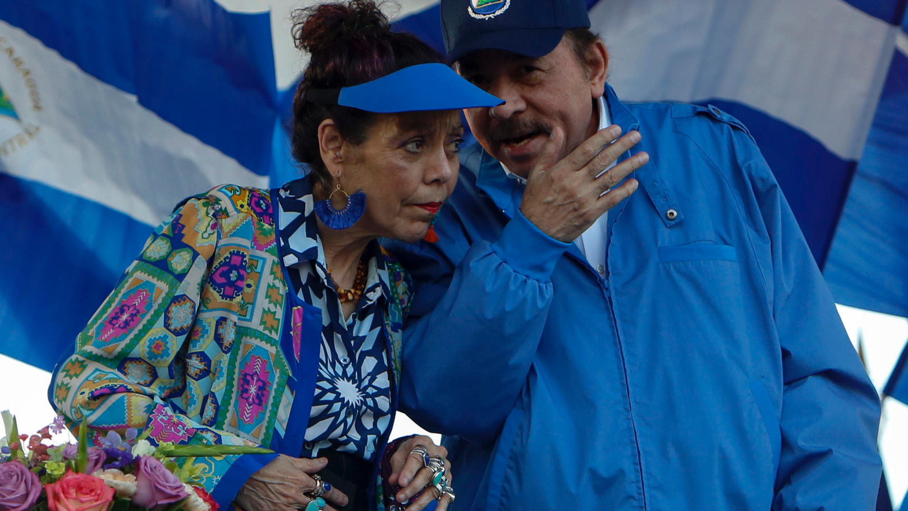 FILE - In this Sept. 5, 2018 file photo, the President of Nicaragua Daniel Ortega and his wife and Vice-President Rosario Murillo preside a rally in Managua, Nicaragua. President Ortega said Thursday, Feb. 21, 2019, that he will restart talks with his opponents, seven months after the last round of dialogue broke down and the government unleashed a round of arrests. (AP Photo/Alfredo Zuniga, File)
