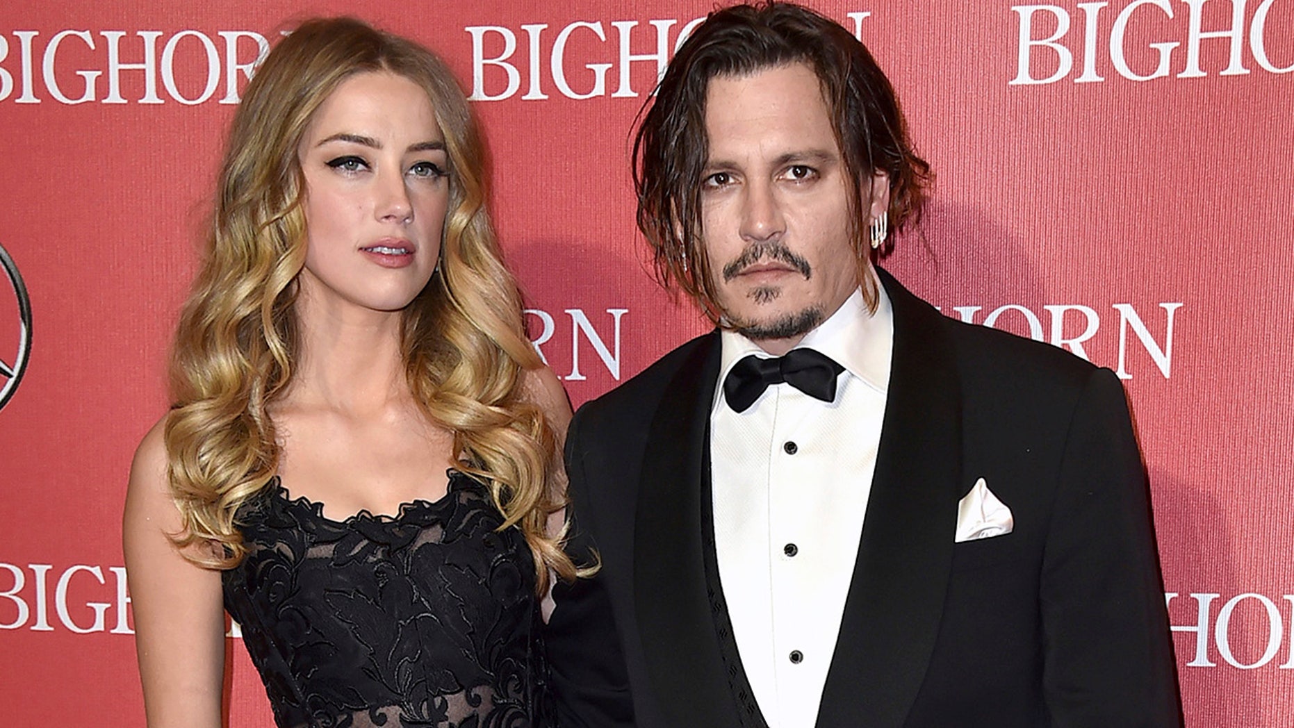 Amber Heard and Johnny Depp arrive at the Palm Springs Film Festival's 27th Annual Palm Springs Awards Gala, California, January 2, 2016. (Associated Press)
