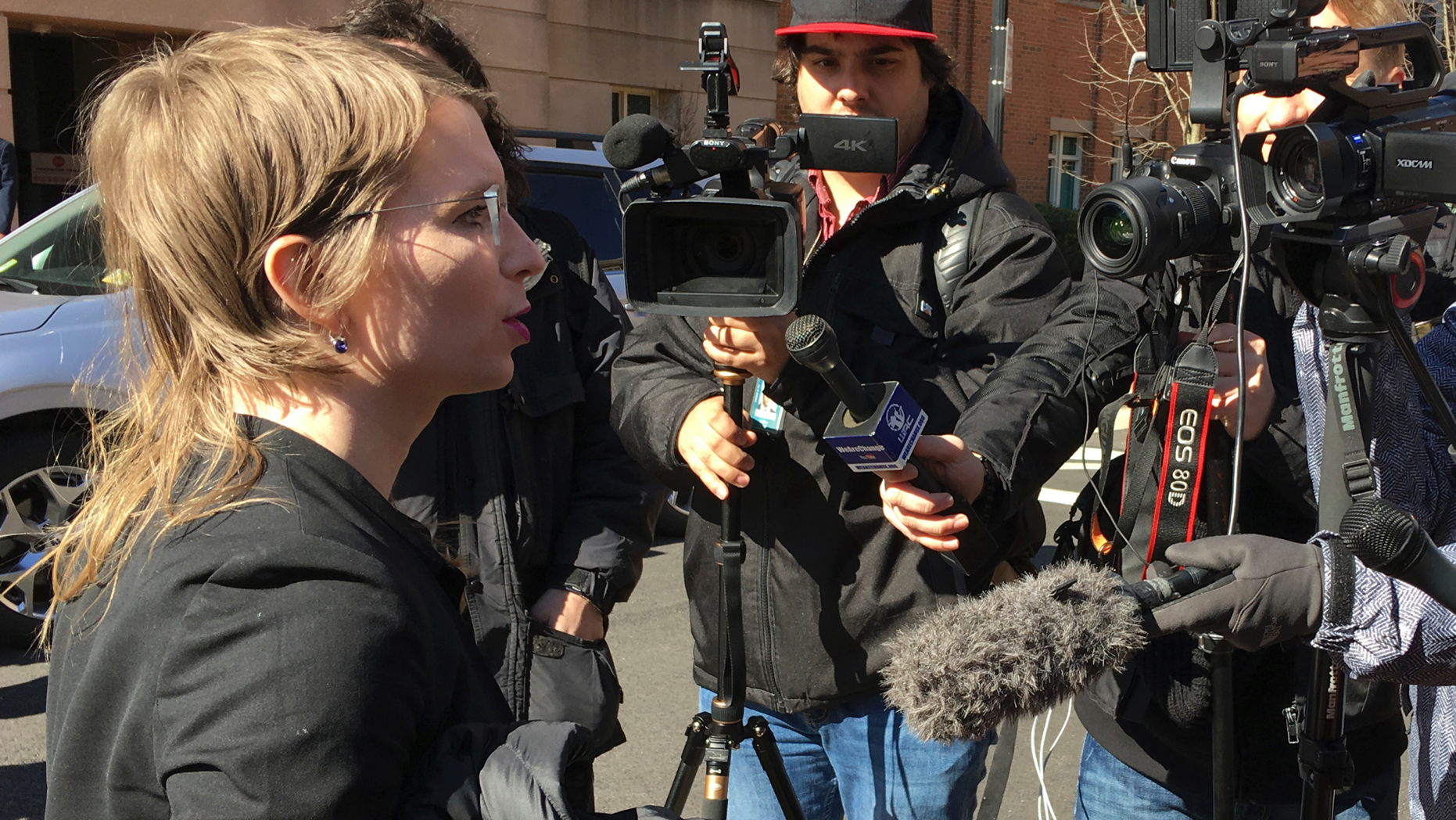 In this Tuesday, March 5, 2019 photo, Chelsea Manning addresses the media outside federal court in Alexandria, Va. The former Army intelligence analyst was ordered to jail Friday, March 8, 2019, for refusing to testify to a Virginia grand jury investigating Wikileaks. (AP Photo/Matthew Barakat)