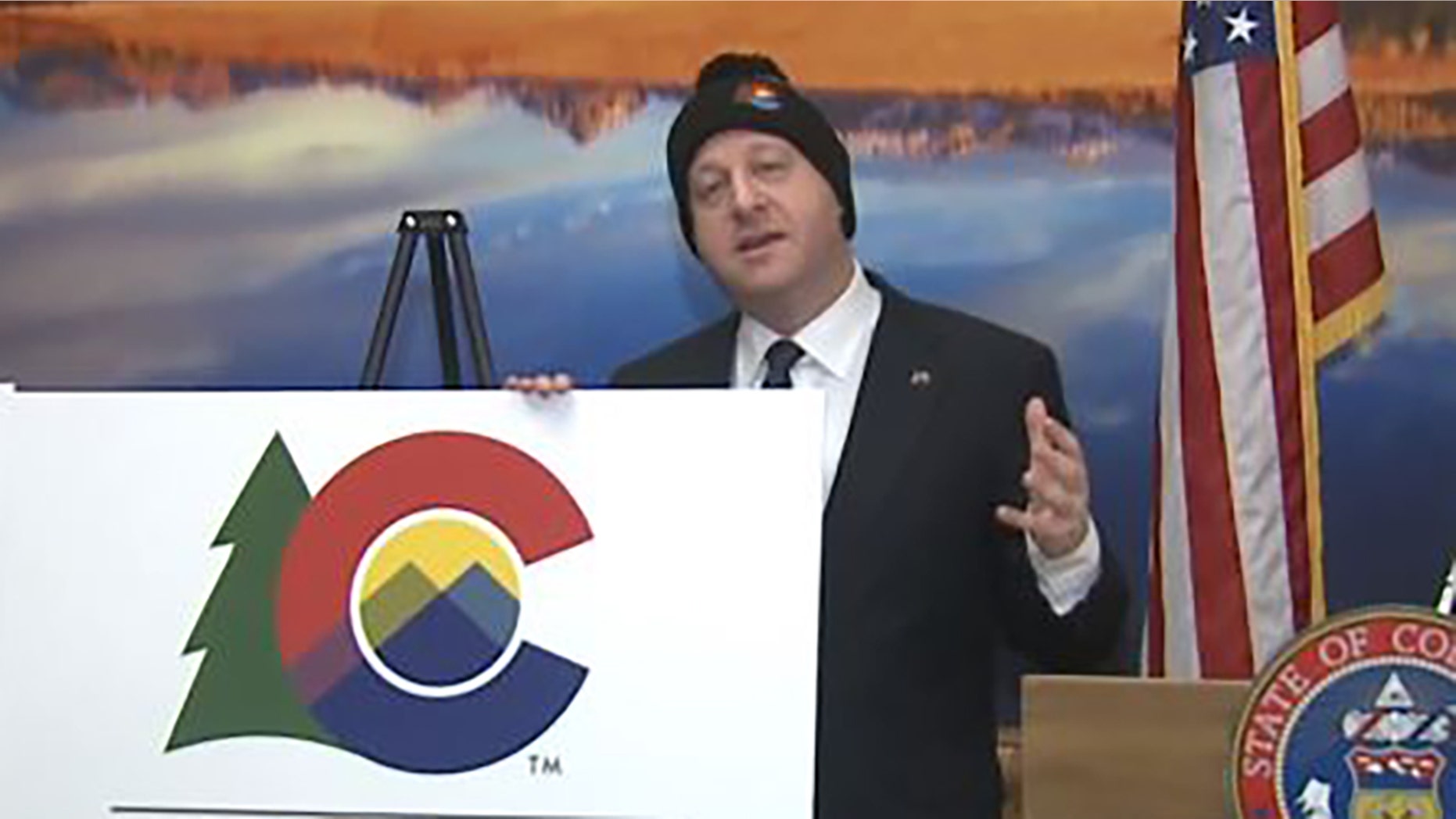 Colorado Gov. Jared Polis unveils the state's new logo Tuesday. (FOX 31 Denver)