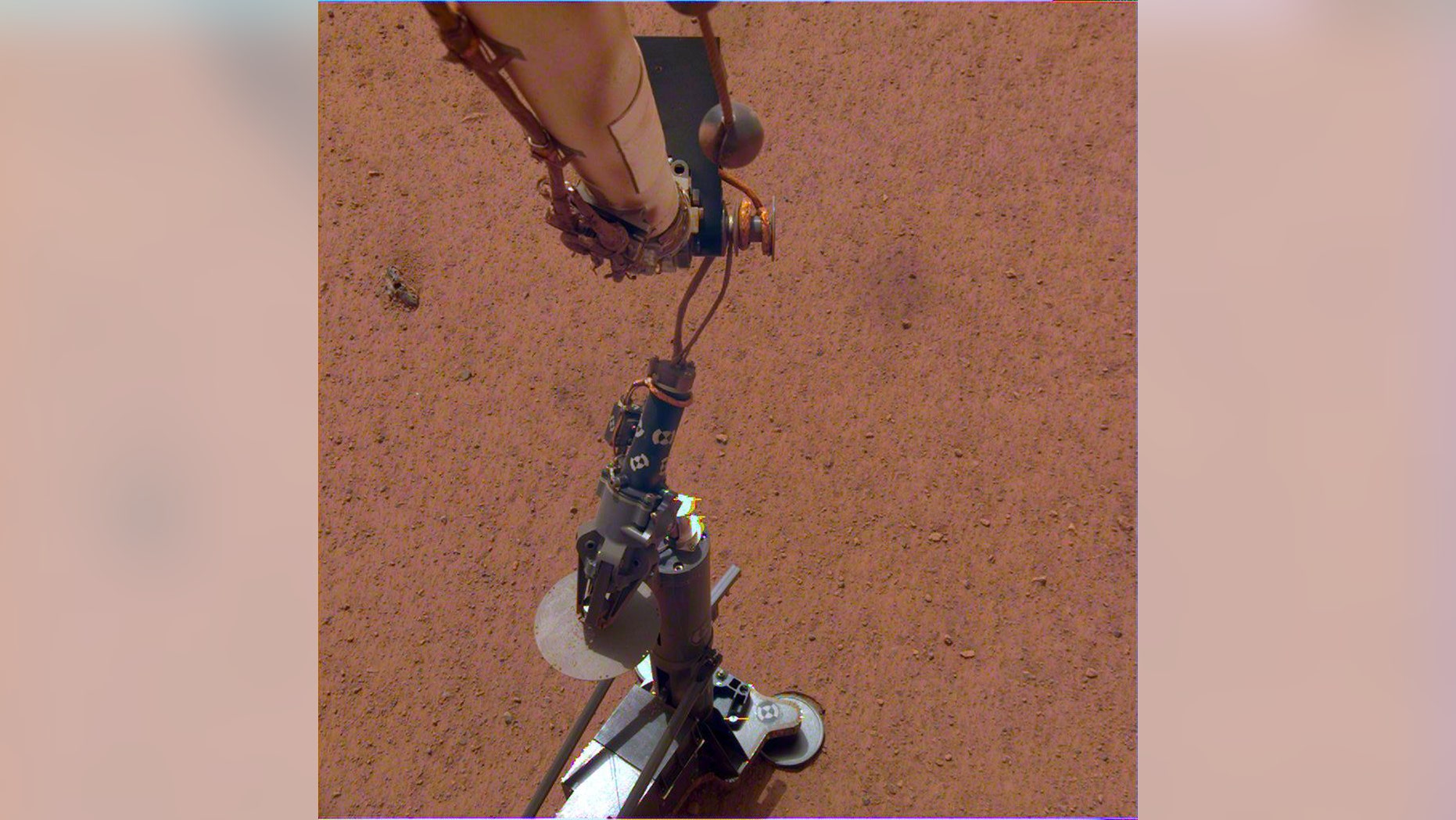 NASA's InSight lander set its heat probe, called the Heat and Physical Properties Package (HP3), on the Martian surface on Feb. 12, 2019. (Credit: NASA/JPL-Caltech/DLR)