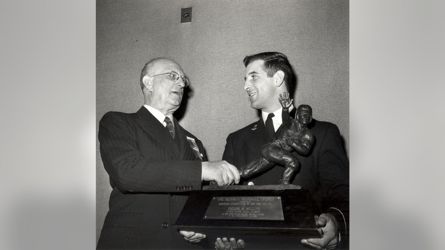Joe Bellino is presented the Heisman trophy in 1960. The Naval Academy's star halfback was the first player to receive the award. Bellino passed away Thursday at 81.