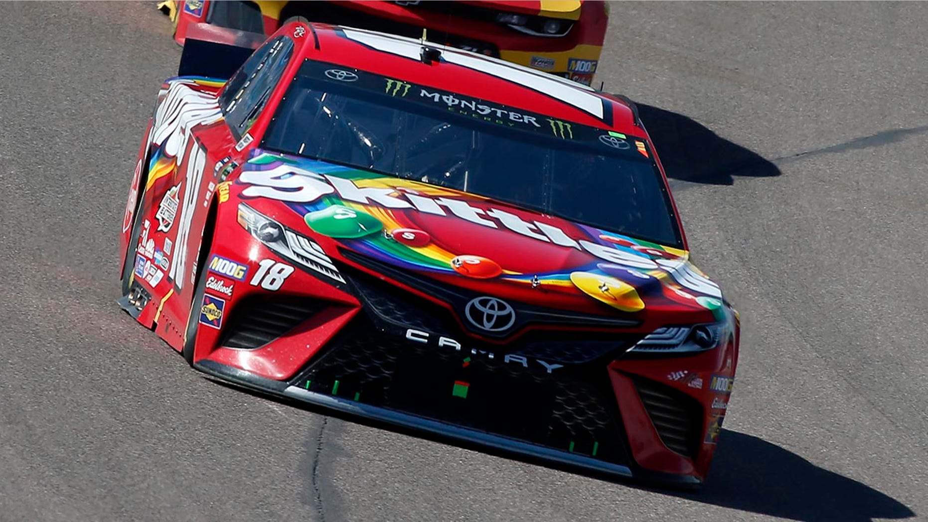 Kyle Busch (18) drives out of Turn 4 during the NASCAR Cup Series auto race at ISM Raceway, Sunday, March 10, 2019, in Avondale, Ariz. (AP Photo/Ralph Freso)