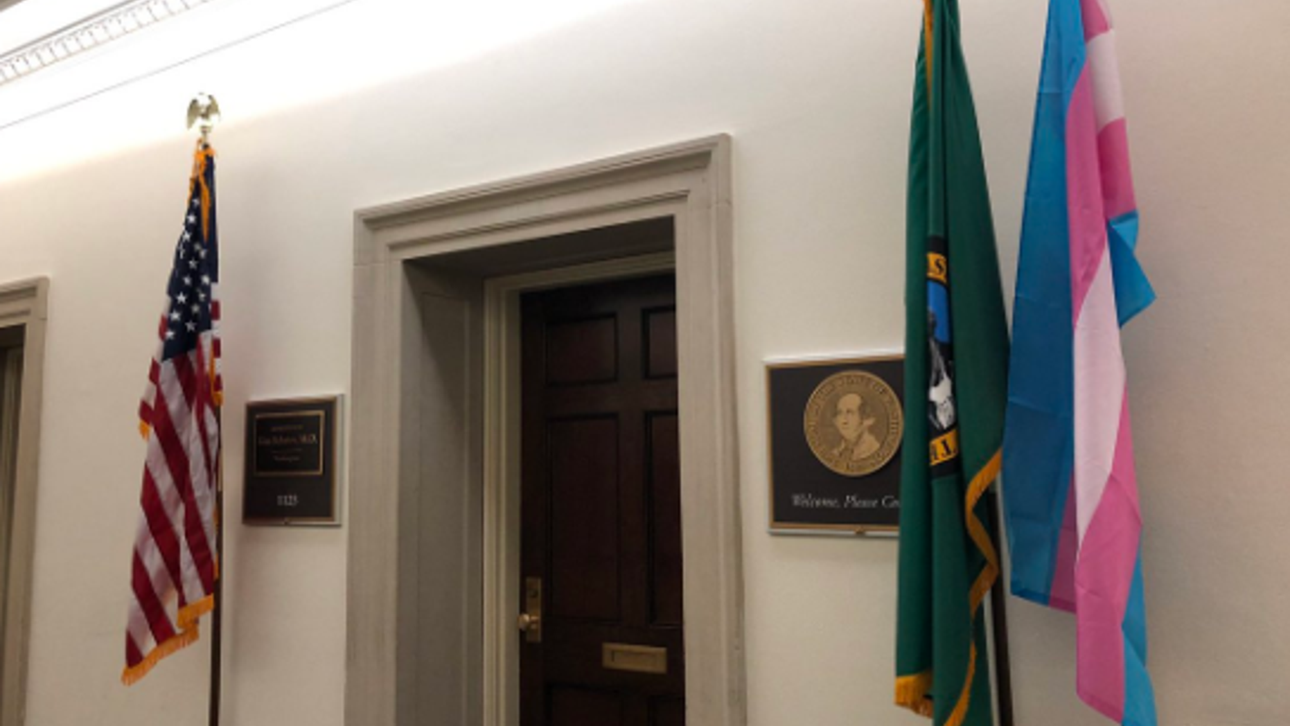 A transgender pride flag, displayed in front of Democratic Rep. Kim Schrier’s office.