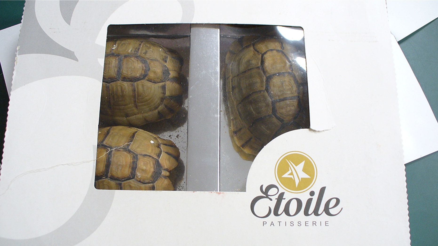 Officials noticed something suspicious about the three pastries inside a 69-year-old man's dessert box.