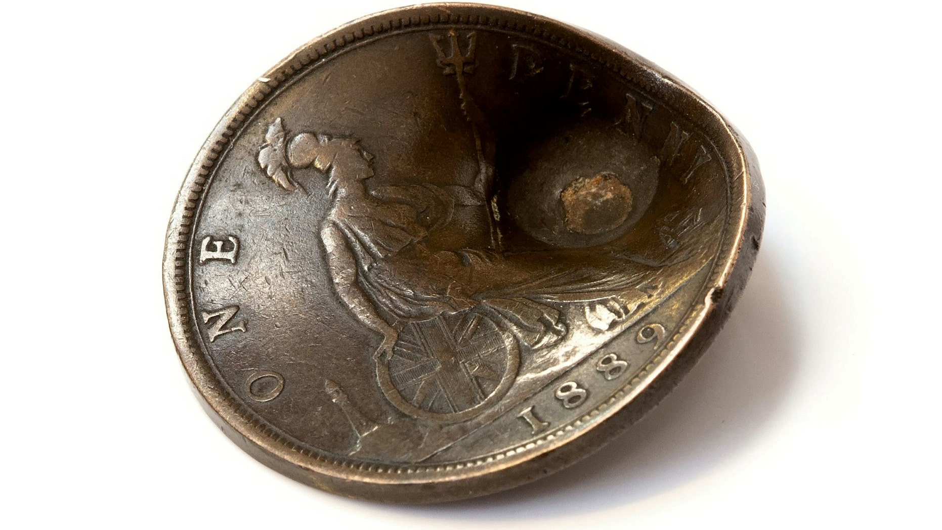 Private John Trickett looked death in the eye when an enemy bullet was aimed at his heart during the First World War – but a penny saved his life. (Credit: SWNS)