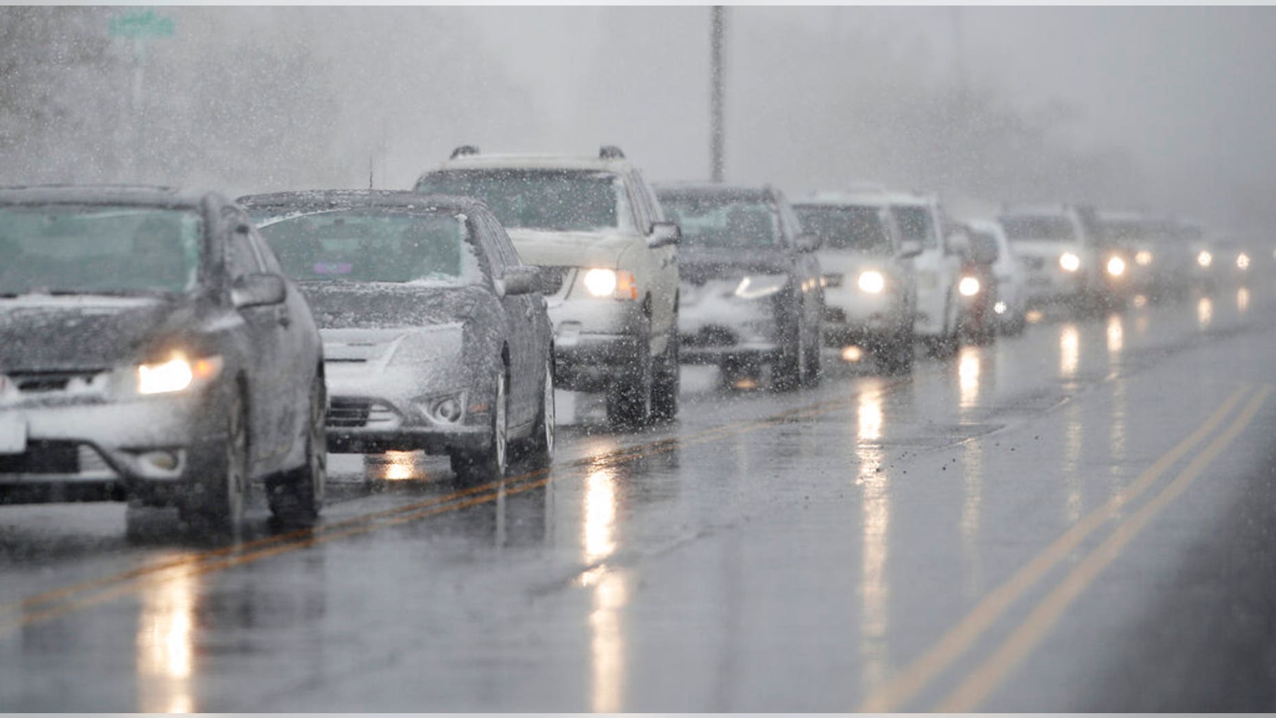 Traffic backs up along 56th Avenue as a spring storm rolls in before the evening rush hour Wednesday, April 10, 2019, in Denver.