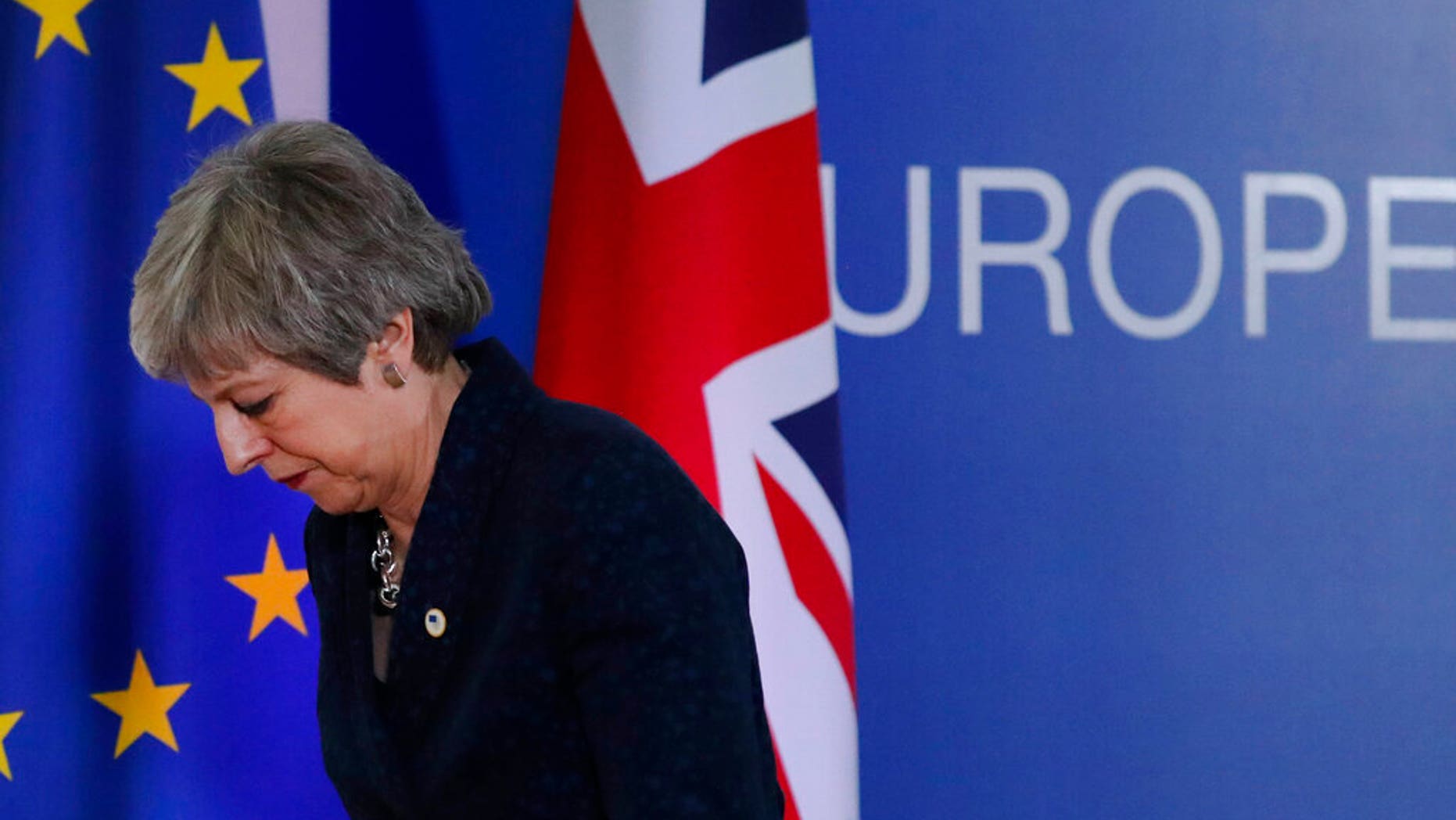 FILE: British Prime Minister Theresa May leaves after addressing a media conference at an EU summit in Brussels.