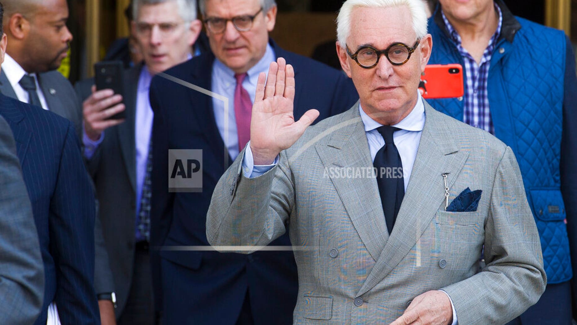 In this photo taken on Thursday, March 14, Roger Stone, a partner of President Trump, leaves the Federal District Court after a status conference. On Friday, Stone asked a federal judge to compel the Department of Justice to hand over a full copy of Special Advocate Robert Mueller's report on the investigation into Russia as part of an investigation into his criminal case. (AP Photo / Cliff Owen, File)