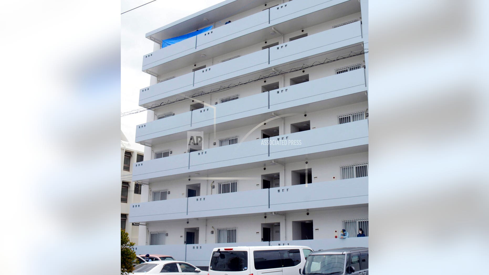 This photo shows an apartment where a U.S. serviceman and a Japanese woman were found dead in Okinawa, southwestern Japan, on Saturday. (Kyodo News via AP)