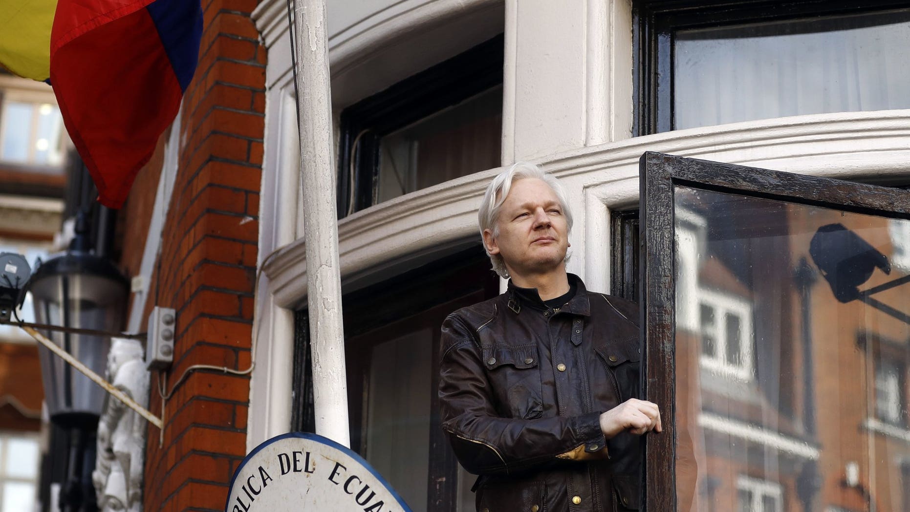 WikiLeaks founder Julian Assange greets supporters outside the Ecuadorian Embassy in London, May 19, 2017. (Associated Press)