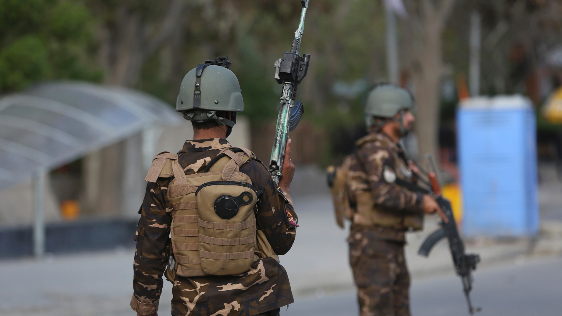 Afghan Security personnel arrive outside the Telecommunication Ministry during a gunfight with insurgents in Kabul, Afghanistan, Saturday, April 20, 2019. A suicide blast rocked Afghanistan's capital Saturday during a gun battle with security forces, officials said, killing several people a day after hopes for all-encompassing peace talks collapsed. (AP Photo/Rahmat Gul)