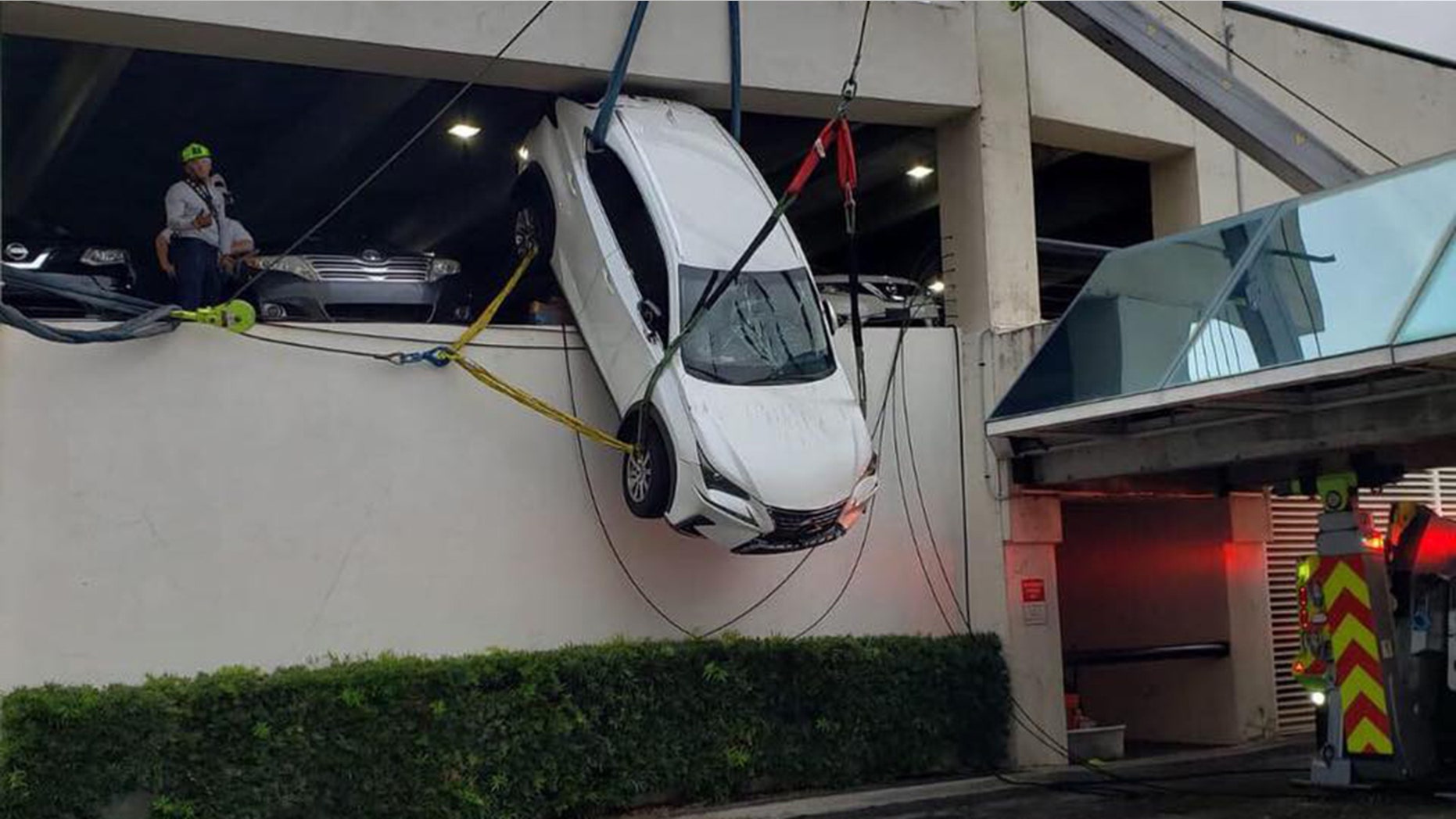A woman in Florida was rescued from an SUV dangling from the second story of a parking garage.