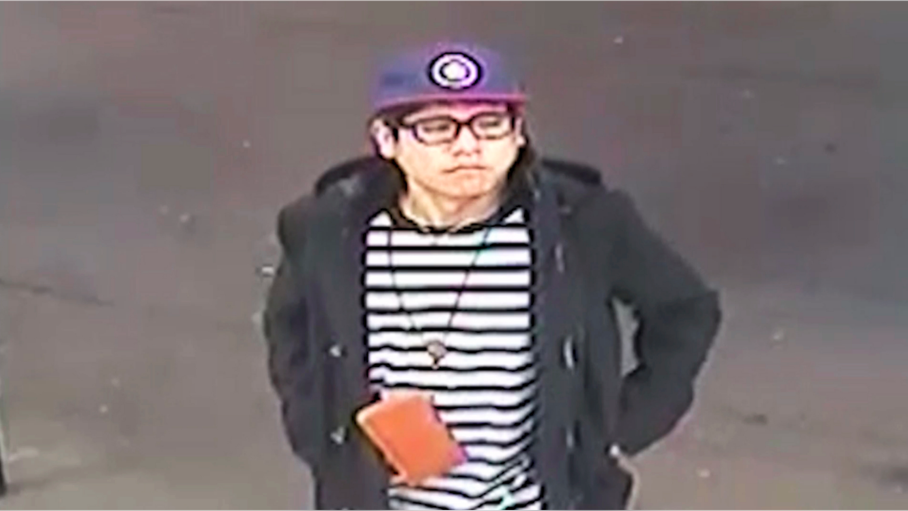 This May 25, 2018 image from surveillance video released by the New South Wales Police Force shows Wachira "Mario" Phetmang, 33, entering a service station in South Hurstville, a suburb of Sydney. Authorities have identified an American suspect in the killing of Phetmang, a Thai national whose battered body was found bound, gagged and wrapped in plastic on the side of a road in a high-profile case in Australia, according to a federal search warrant obtained Tuesday, April 9. 2019. (New South Wales Police via AP)