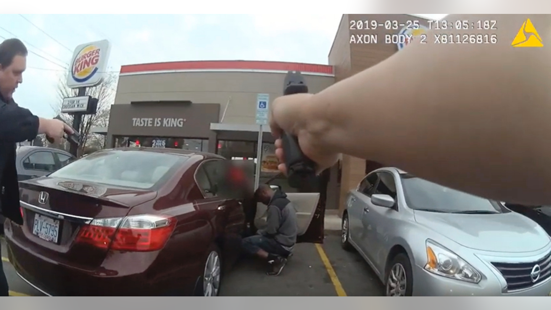 In this frame grab from a Charlotte-Mecklenburg Police Department officer body camera released Monday, April 15, 2019, shows two officers approaching 27-year-old Danquirs Napoleon Franklin outside a Burger King on March 29, 2019 in Charlotte, NC. Franklin was shot and killed. (Charlotte-Mecklenburg Police Department via AP)